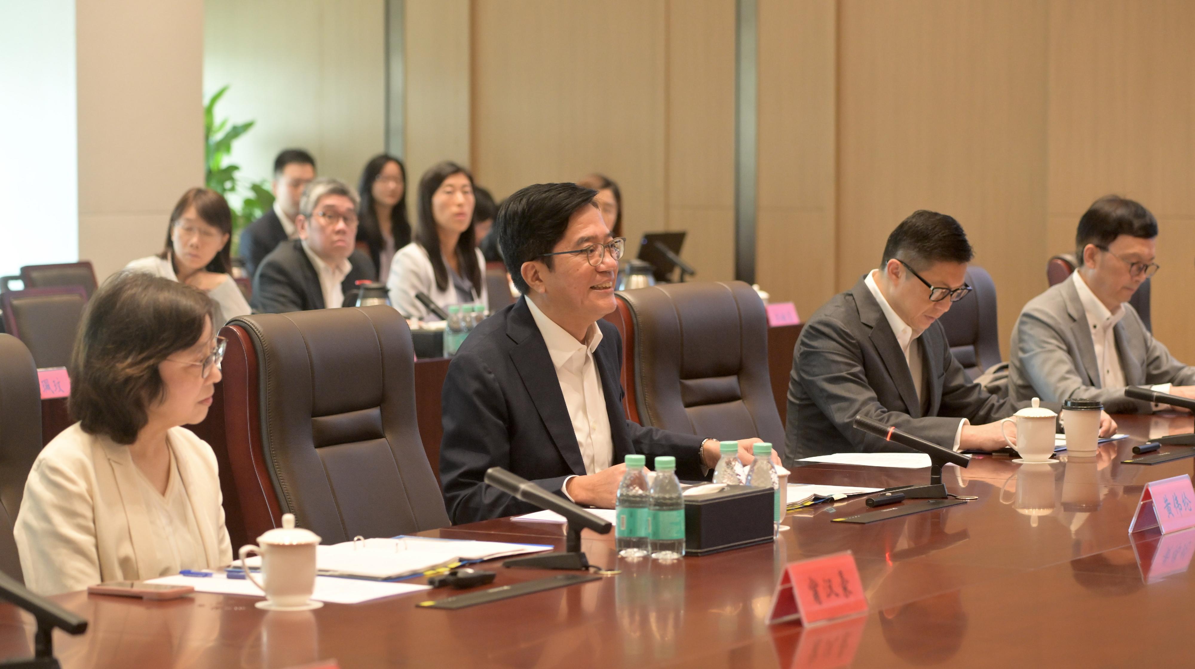 The Deputy Financial Secretary, Mr Michael Wong, and Vice Mayor of the Shenzhen Municipal People's Government Mr Huang Min, leading delegations of the governments of the Hong Kong Special Administrative Region and Shenzhen respectively, held a meeting of the Task Force for Collaboration on the Northern Metropolis Development Strategy in Shenzhen today (October 11). Photo shows Mr Wong (second left) delivering his opening remarks at the meeting. Looking on are the Secretary for Development, Ms Bernadette Linn (first left); the Secretary for Security, Mr Tang Ping-keung (second right); and the Acting Secretary for Transport and Logistics, Mr Liu Chun-san (first right). 