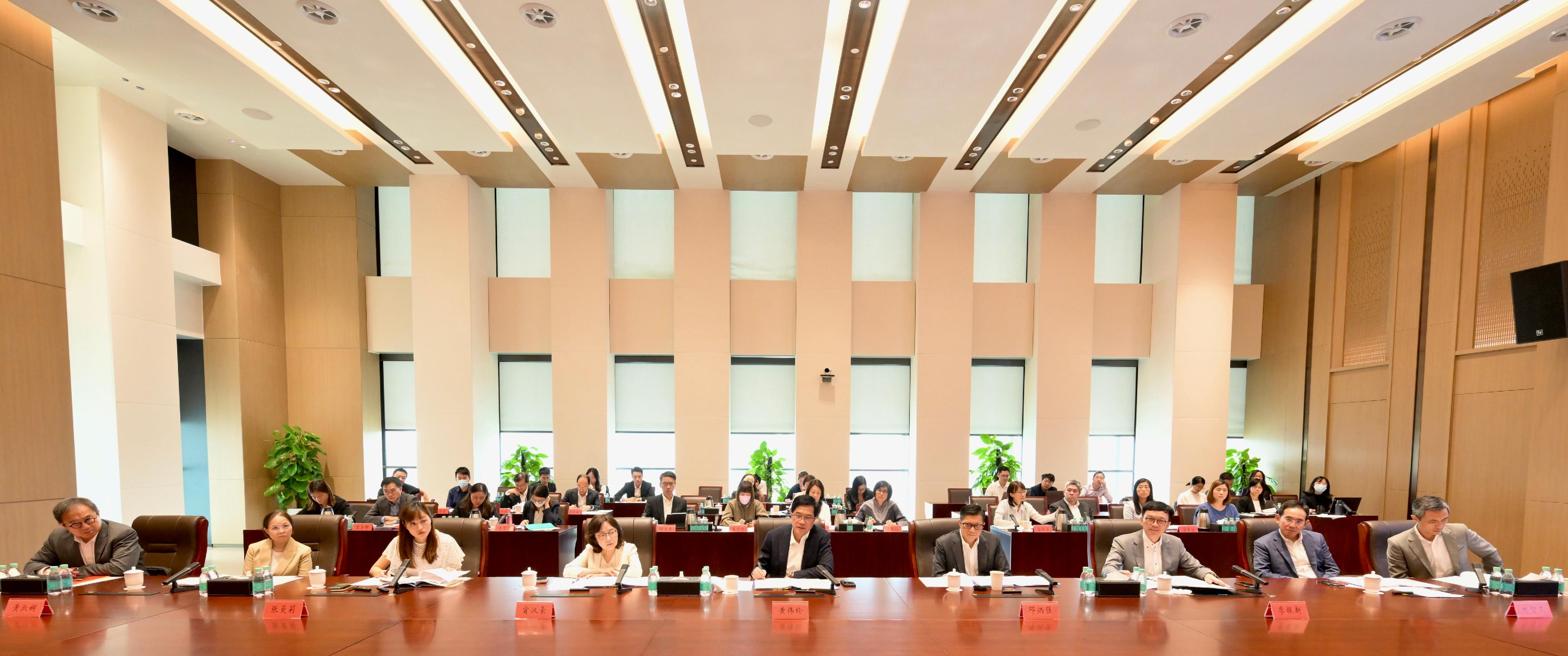 The Deputy Financial Secretary, Mr Michael Wong (first row, centre), and Vice Mayor of the Shenzhen Municipal People's Government Mr Huang Min, leading delegations of the governments of the Hong Kong Special Administrative Region and Shenzhen respectively, held a meeting of the Task Force for Collaboration on the Northern Metropolis Development Strategy in Shenzhen today (October 11). Also attending are the Secretary for Development, Ms Bernadette Linn (first row, fourth left); the Secretary for Security, Mr Tang Ping-keung (first row, fourth right); the Acting Secretary for Transport and Logistics, Mr Liu Chun-san (first row, third right); the Under Secretary for Development, Mr David Lam (first row, second right); the Under Secretary for Innovation, Technology and Industry, Ms Lillian Cheong (first row, third left); the Under Secretary for Environment and Ecology, Miss Diane Wong (first row, second left); the Permanent Secretary for Culture, Sports and Tourism, Mr Joe Wong (first row, first left); and the Director of the Northern Metropolis Co-ordination Office, Mr Vic Yau (first row, first left).