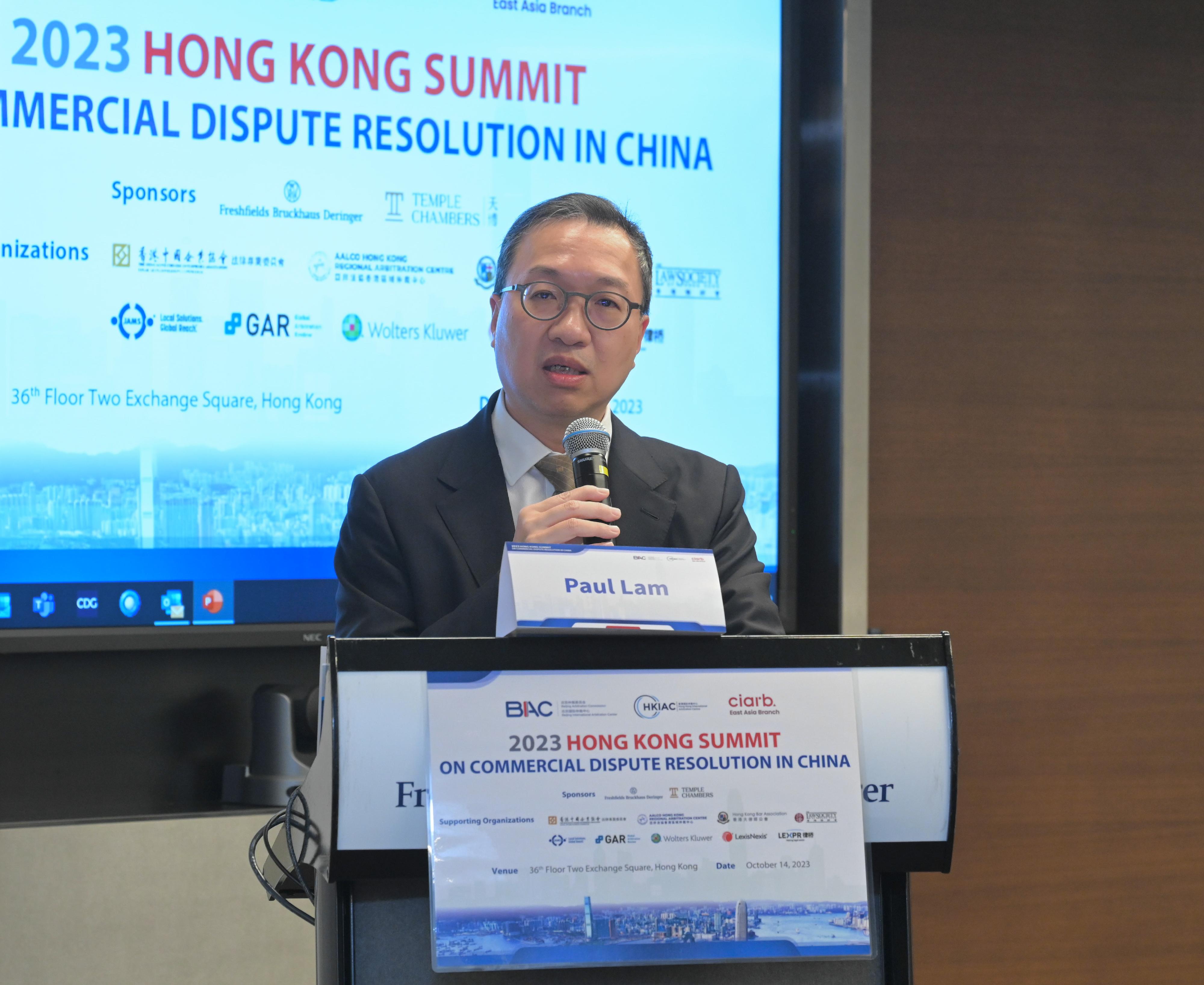 The Secretary for Justice, Mr Paul Lam, SC, speaks at the 2023 Hong Kong Summit on Commercial Dispute Resolution in China today (October 14).
