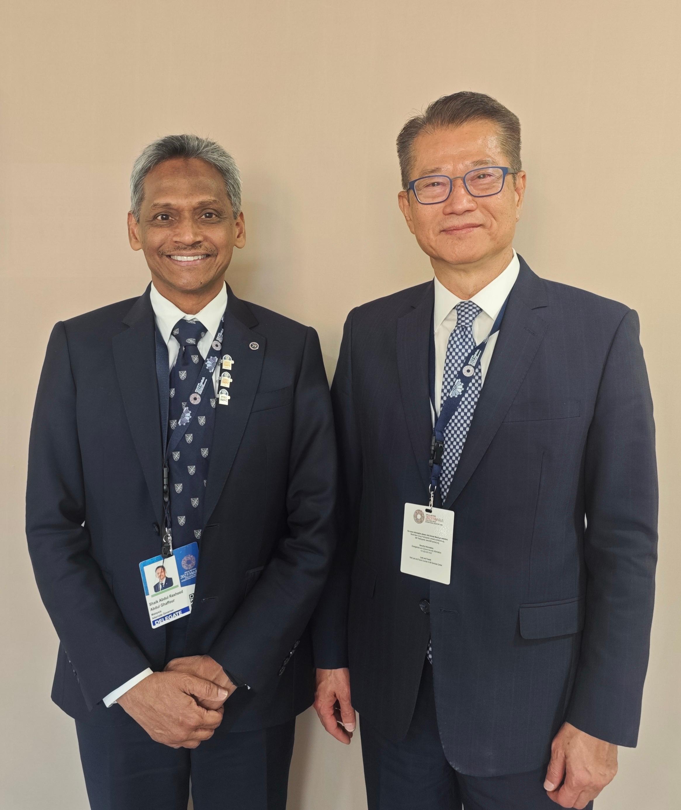 The Financial Secretary, Mr Paul Chan, continued to attend the 2023 Annual Meetings of the International Monetary Fund (IMF) and the World Bank Group (WBG) in Marrakech, Morocco, today (October 14, Marrakech time), as a member of the Chinese delegation. Photo shows Mr Chan (right) meeting with the Governor of the Central Bank of Malaysia, Mr Abdul Rasheed Ghaffour (left).