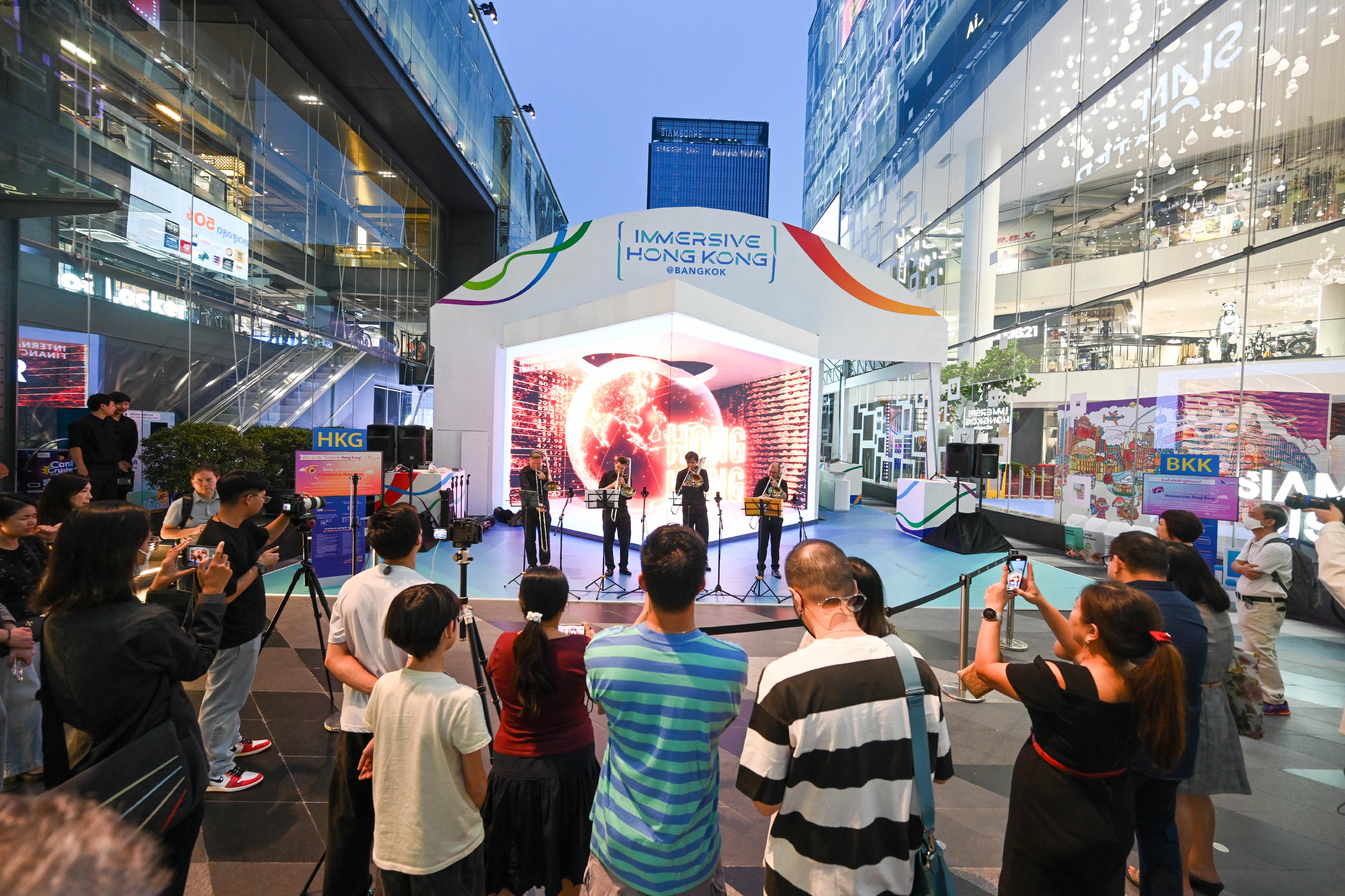 The "Immersive Hong Kong" roving exhibition, which showcases Hong Kong's unique strengths, advantages and opportunities with art technology, was launched in Bangkok, Thailand, today (October 20) as part of a promotional campaign in Association of Southeast Asian Nations countries. Photo shows a trombone quartet from the Hong Kong Philharmonic Orchestra performing at the exhibition venue.