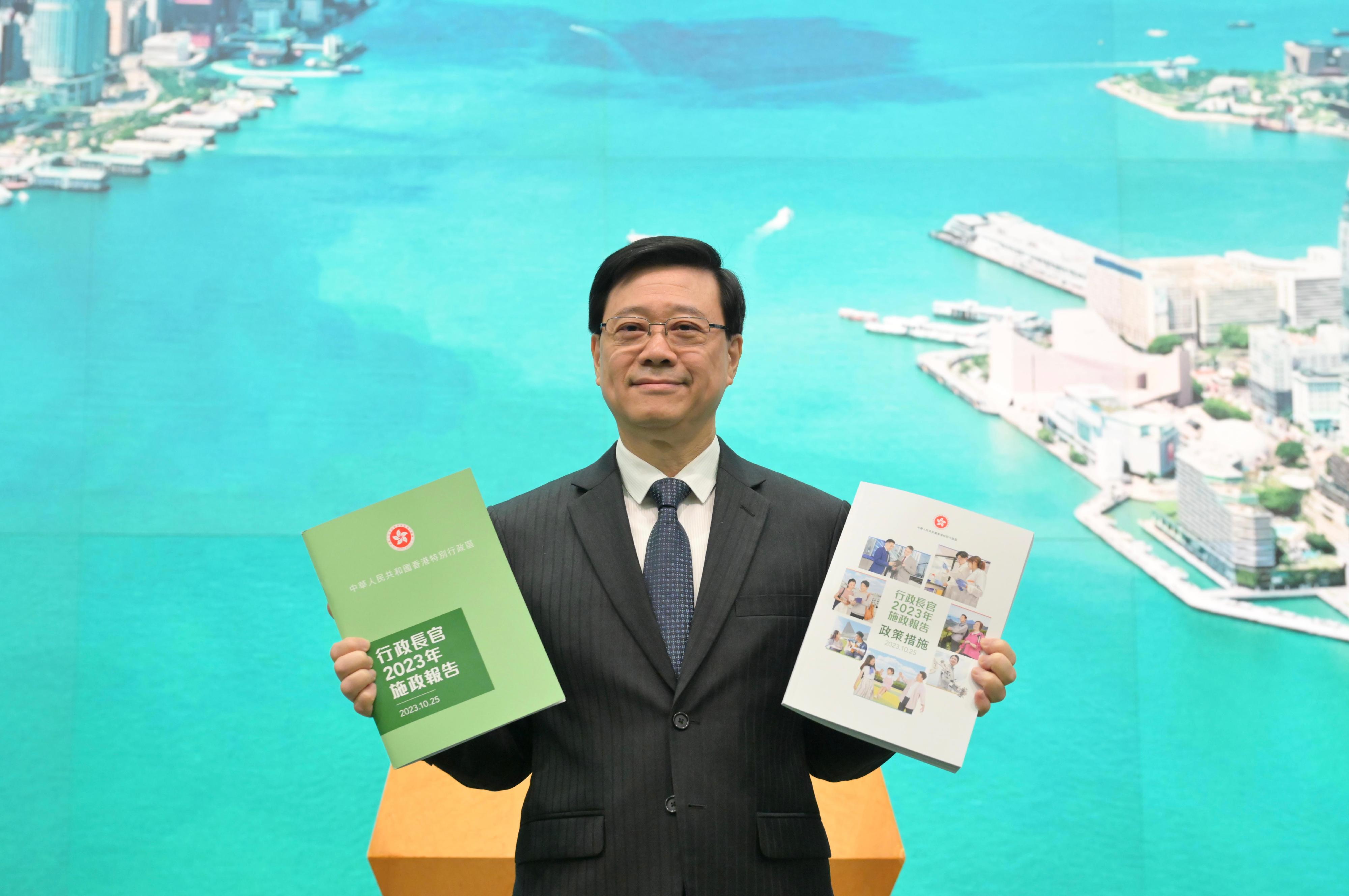 The Chief Executive, Mr John Lee, met the media before the Executive Council meeting this morning (October 24). Photo shows Mr Lee holding "The Chief Executive's 2023 Policy Address" and "The Chief Executive's 2023 Policy Address" Policy Measures to be delivered tomorrow (October 25).