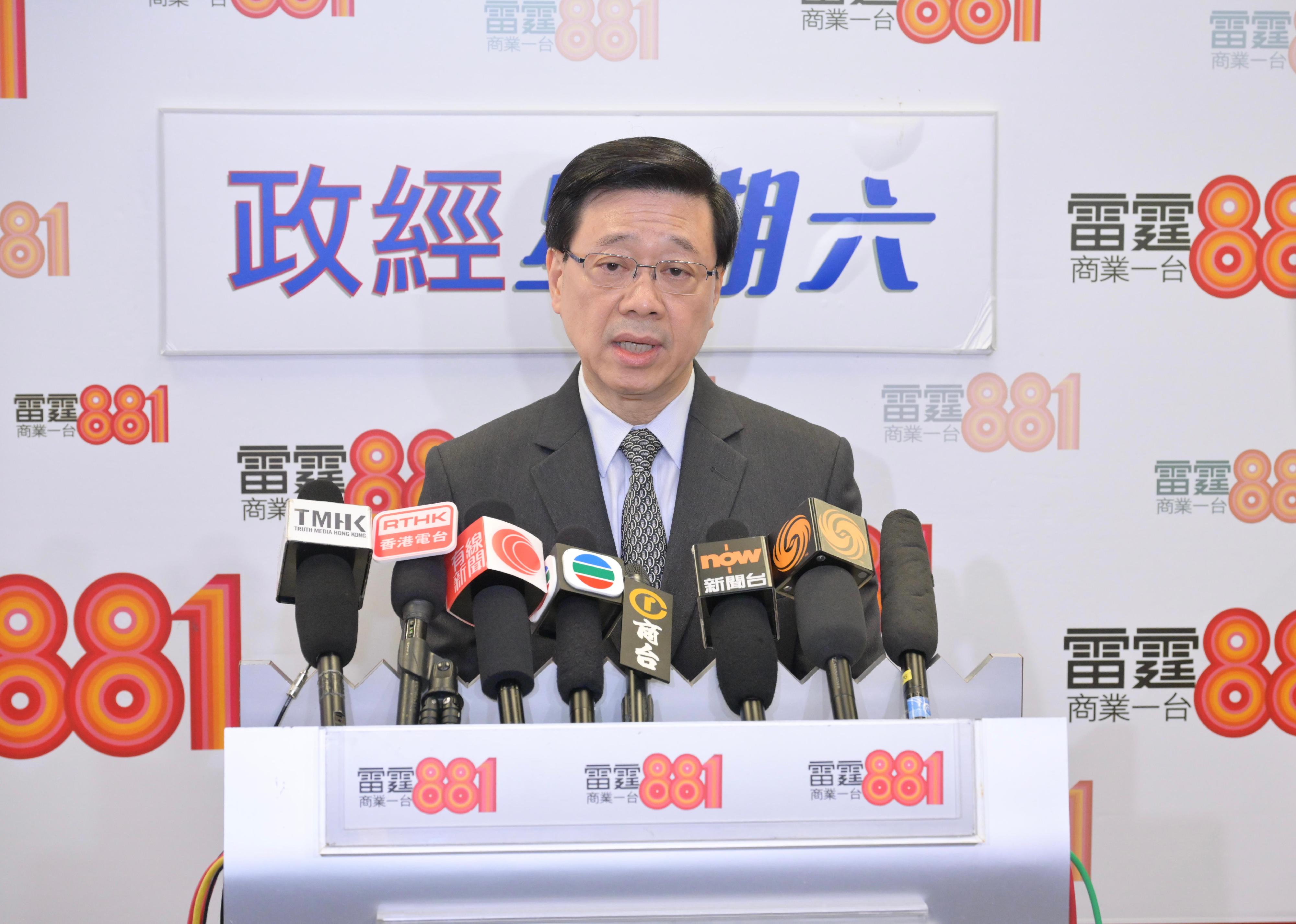 The Chief Executive, Mr John Lee, meets the media after attending a radio programme this morning (October 28).