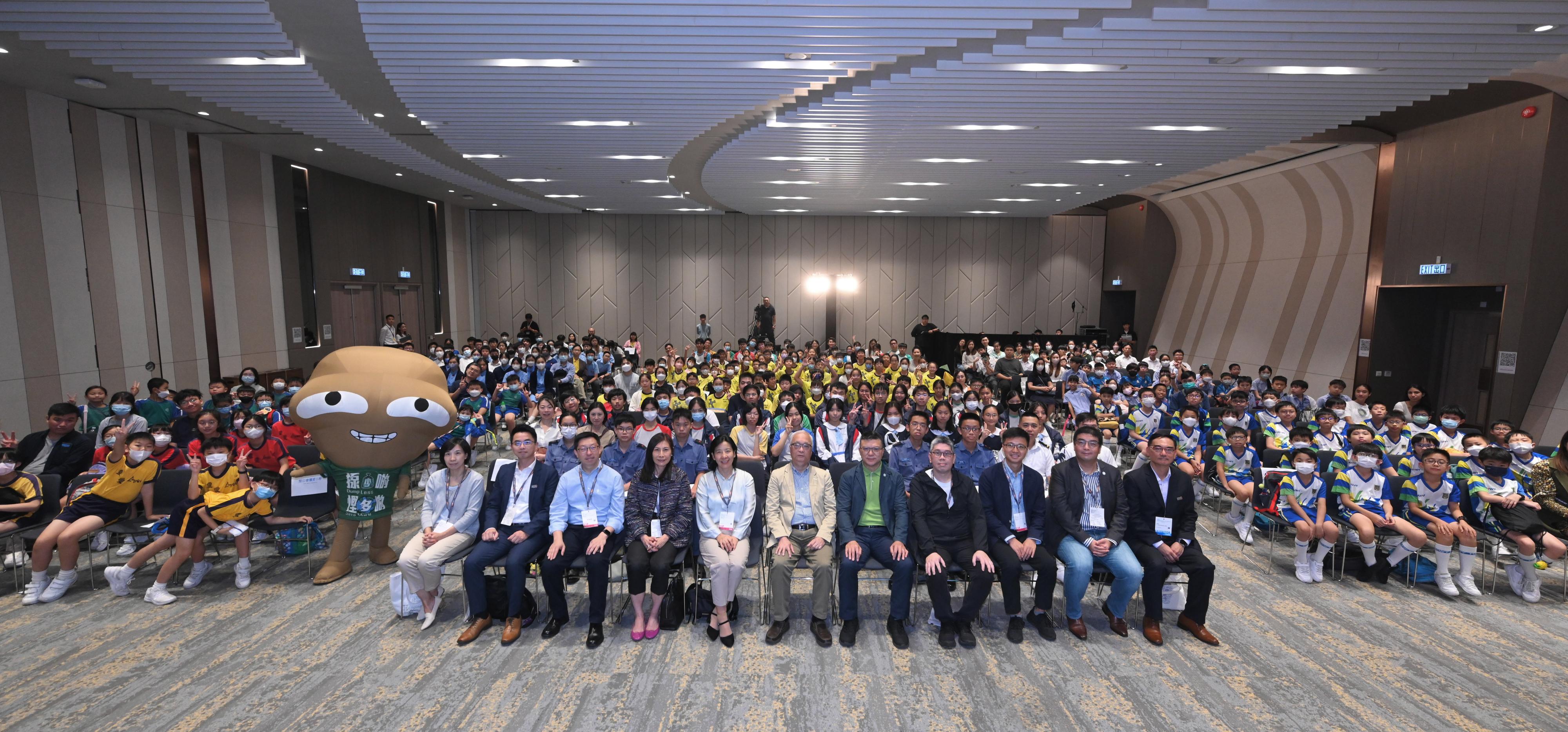 The Secretary for Environment and Ecology, Mr Tse Chin-wan (first row, centre), and the Director of the Department of Educational, Scientific and Technological Affairs of the Liaison Office of the Central People's Government in the Hong Kong Special Administrative Region, Ms Guo Jianhua (first row, fifth left), take a group photo with guests and young people during the "Dialogue with the Secretary for Environment and Ecology" session on the public day of the 18th Eco Expo Asia today (October 29).