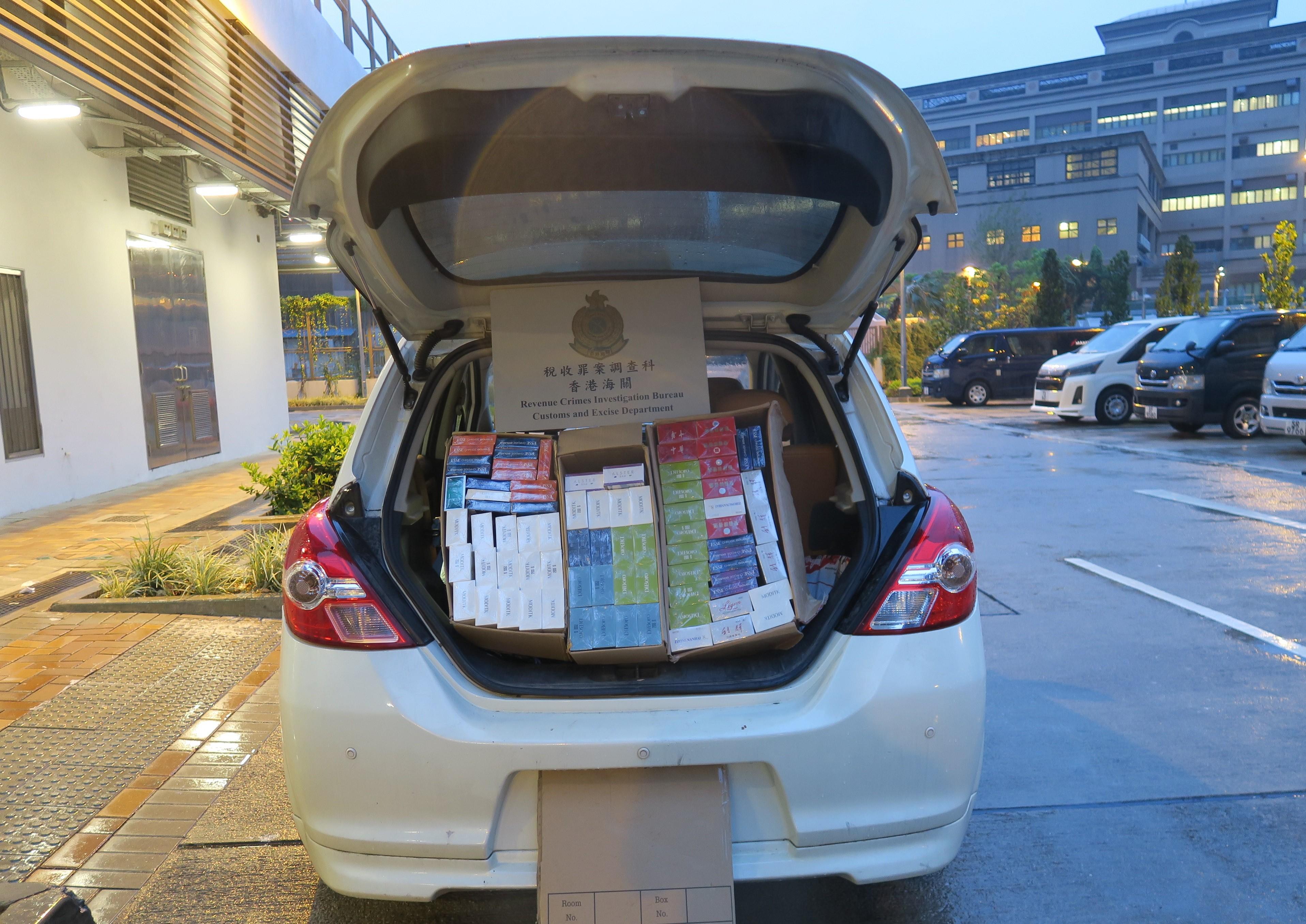 Hong Kong Customs mounted a territory-wide enforcement operation codenamed "Thunder" in the past three weeks to combat illicit cigarette telephone-ordering activities in public rental housing. A total of about 2.8 million suspected illicit cigarettes with an estimated market value of about $10 million and a duty potential of about $7 million were seized. Photo shows some of the suspected illicit cigarettes seized and a vehicle suspected to be used for illicit cigarette distribution.