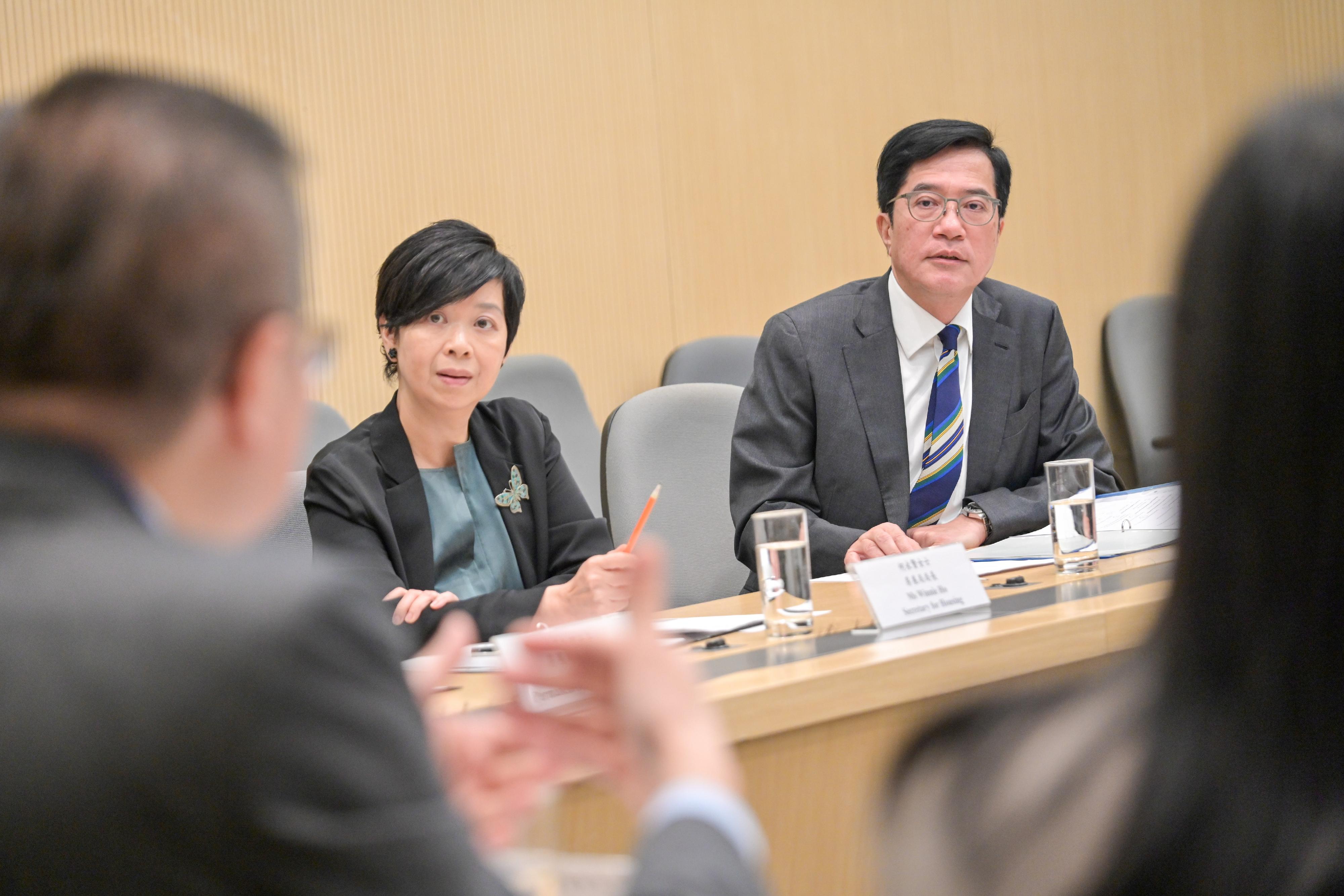 The Deputy Financial Secretary, Mr Michael Wong (right), convened the first meeting as the Head of the Task Force on Tackling the Issue of Subdivided Units today (November 3). Beside him is the Deputy Head of the Task Force and the Secretary for Housing, Ms Winnie Ho (left).