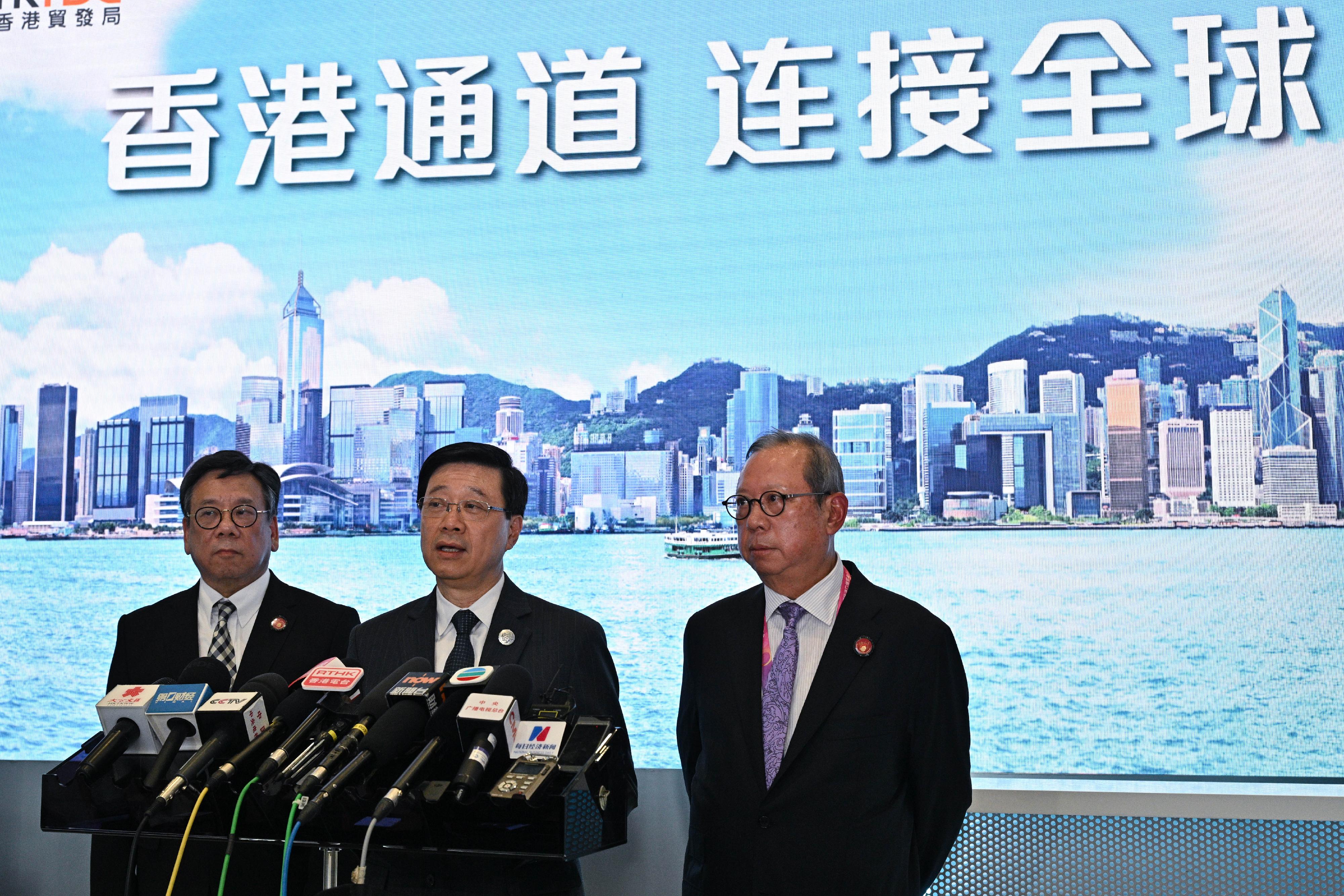 The Chief Executive, Mr John Lee (centre), with the Secretary for Commerce and Economic Development, Mr Algernon Yau (left), and the Chairman of the Hong Kong Trade Development Council, Dr Peter Lam (right), meet the media in Shanghai to conclude the visit today (November 5).