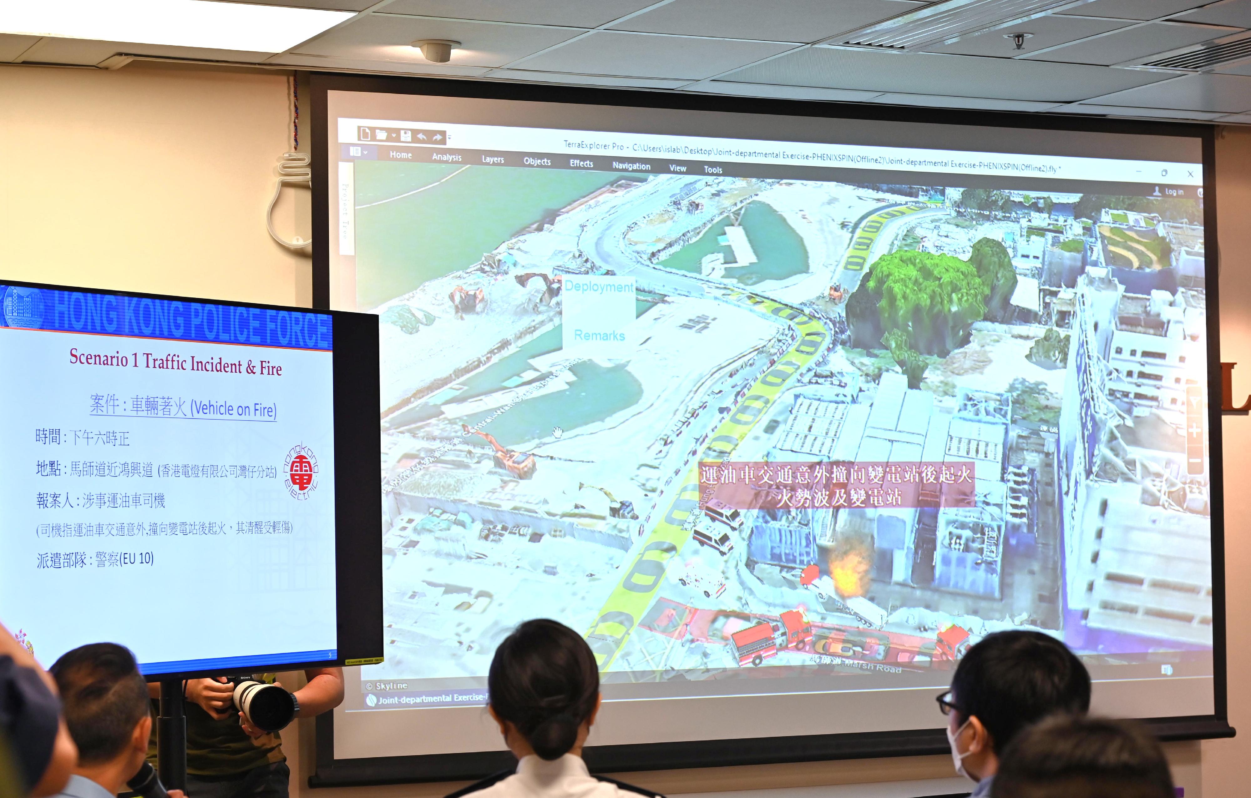 Police Hong Kong Island Regional Headquarters, together with the Hospital Authority, the Fire Services Department, the Transport Department, the Electrical and Mechanical Services Department, the Lands Department and the Hongkong Electric Company, Limited, conducted an inter-departmental major incident exercise codenamed "PHOENIXSPIN" this morning (November 5). Picture shows Police utilising the Geospatial Analytics, Information and Applications (GAIA) system for the first time, which was developed by the Innovation and Solution Lab, Information Systems Wing of Police.