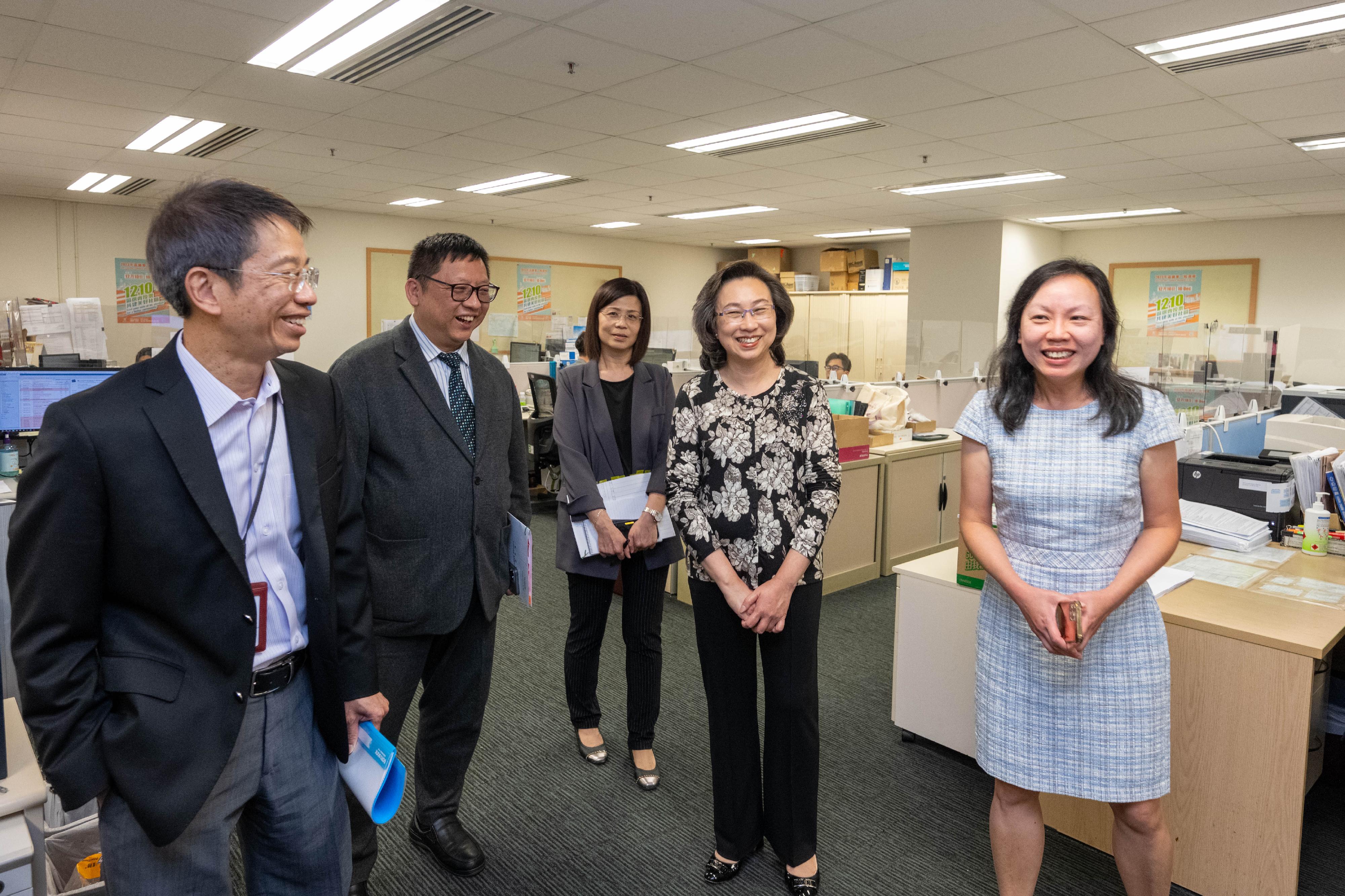 The Secretary for the Civil Service, Mrs Ingrid Yeung, visited the Information Services Department today (November 6). Photo shows Mrs Yeung (second right) visiting the News Sub-division, which is responsible for issuing all government press releases, photographs and video clips, to know more about its 24-hour press enquiry service. Looking on are the Permanent Secretary for the Civil Service, Mr Clement Leung (first left), and the Director of Information Services, Mr Fletch Chan (second left).