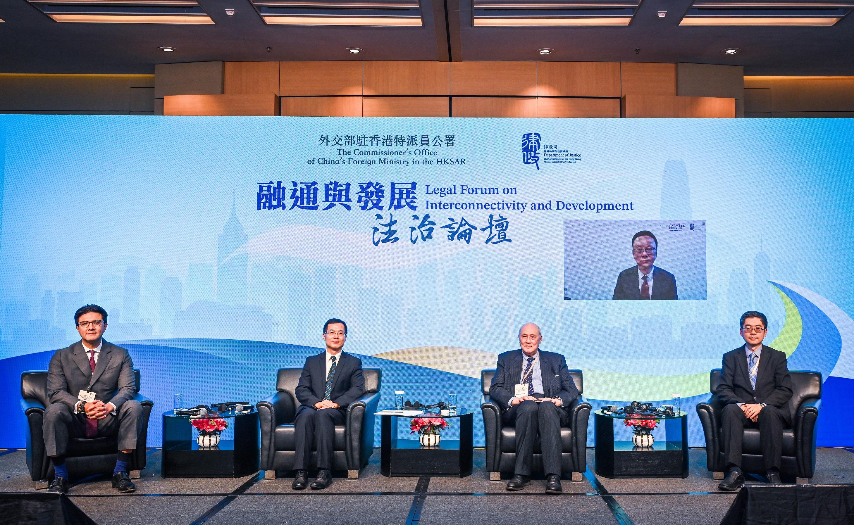 As part of the Hong Kong Legal Week 2023, the Legal Forum on Interconnectivity and Development co-organised by the Office of the Commissioner of the Ministry of Foreign Affairs in the Hong Kong Special Administrative Region and the Department of Justice (DoJ) was held successfully today (November 7). Photo shows (from left) Vice-Chairman of the Hong Kong Bar Association Mr José-Antonio Maurellet, SC; the Representative of Regional Office for Asia and the Pacific of the Hague Conference on Private International Law and Associate Dean of the Faculty of Law of the University of Hong Kong, Professor Zhao Yun; Co-Chairman of the Asian Academy of International Law, Dr Anthony Neoh; Qian Duansheng Chair Professor of China University of Political Science and Law and Changjiang Scholars Distinguished Professor of the Ministry of Education of the People's Republic of China, Professor Huo Zhengxin (on screen); and Law Officer (International Law) of the DoJ, Dr James Ding at panel session 2 on legal instruments in addressing external challenges. 