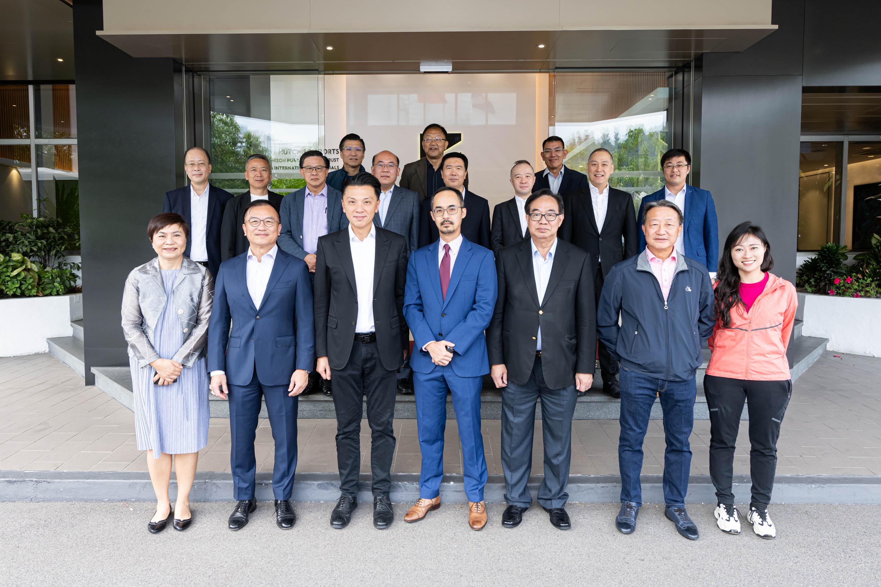 The Legislative Council (LegCo) Panel on Economic Development visited the Kwai Tsing Container Terminals (KTCT) today (November 7) to further understand the latest developments of the terminals' digital operations and the logistics industry. Photo shows LegCo Members posing for a group photo with representatives of the KTCT.