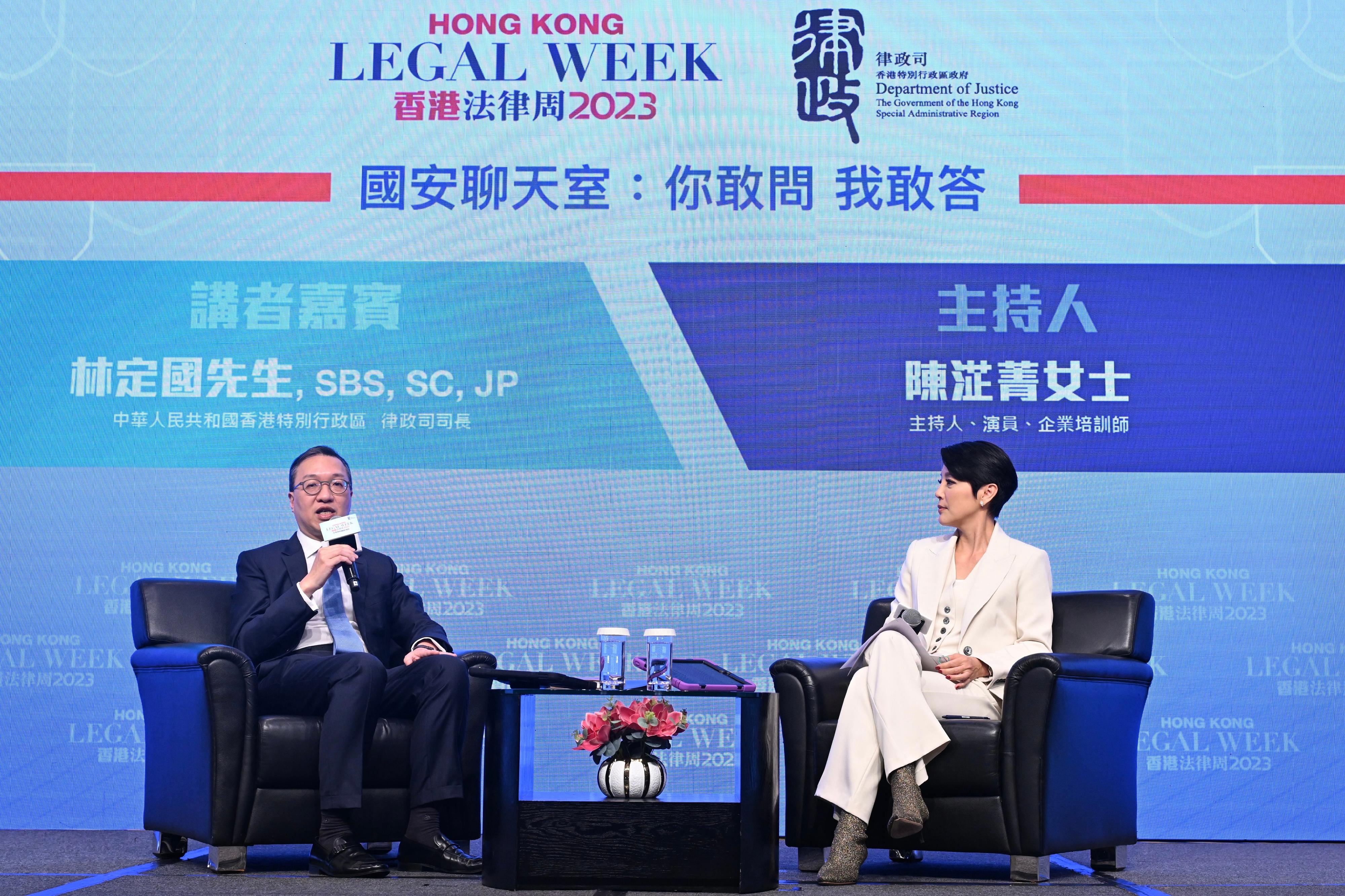 Hong Kong Legal Week 2023, an annual flagship event of the legal sector and the Department of Justice, successfully concluded today (November 10). Photo shows the Secretary for Justice, Mr Paul Lam, SC (left), and emcee Astrid Chan (right) at the National Security Chatroom: "You ask, I answer" at the Rule of Law for the Future.