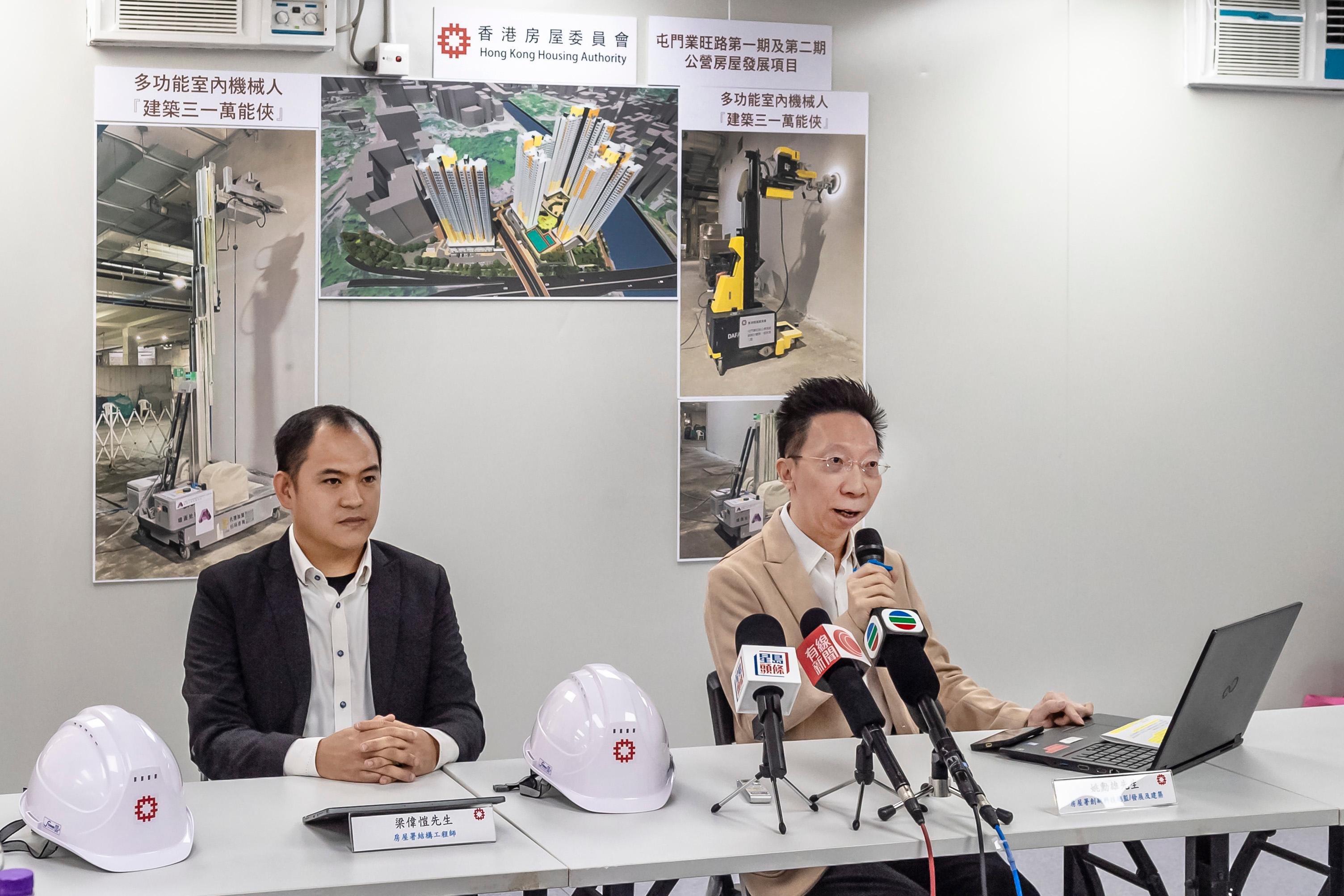 The Hong Kong Housing Authority introduced multifunctional indoor construction robot, the first of its kind, to boost safety at public housing sites. Photo shows the Head/Development and Construction InnoTech, Mr Romeo Yiu (right), and Structural Engineer Mr Arthur Leung (left) of the Housing Department at the media briefing.