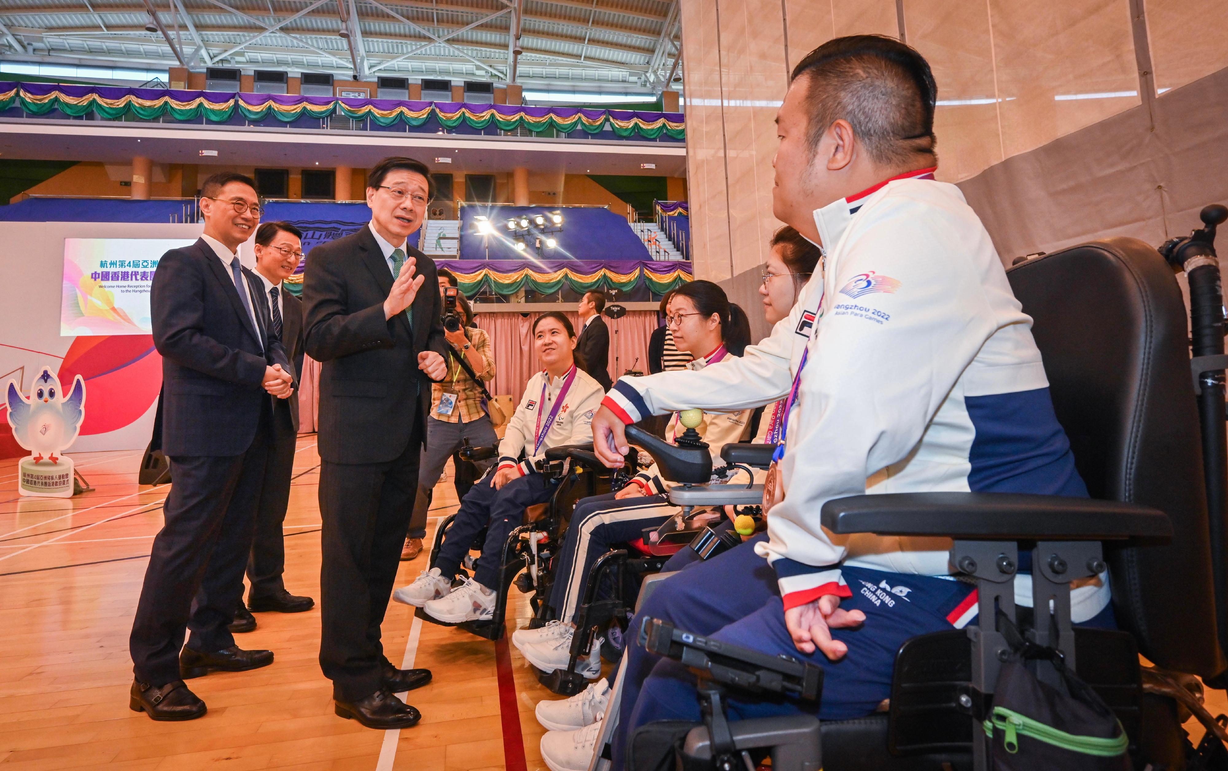 The Chief Executive, Mr John Lee, attended the welcome home reception for the Hong Kong, China Delegation from the 4th Asian Para Games Hangzhou today (November 13). Photo shows Mr Lee (front row, second left), accompanied by the Secretary for Culture, Sports and Tourism, Mr Kevin Yeung (front row, first left), and the Director of Leisure and Cultural Services, Mr Vincent Liu (back row, first left), interacting with athletes.