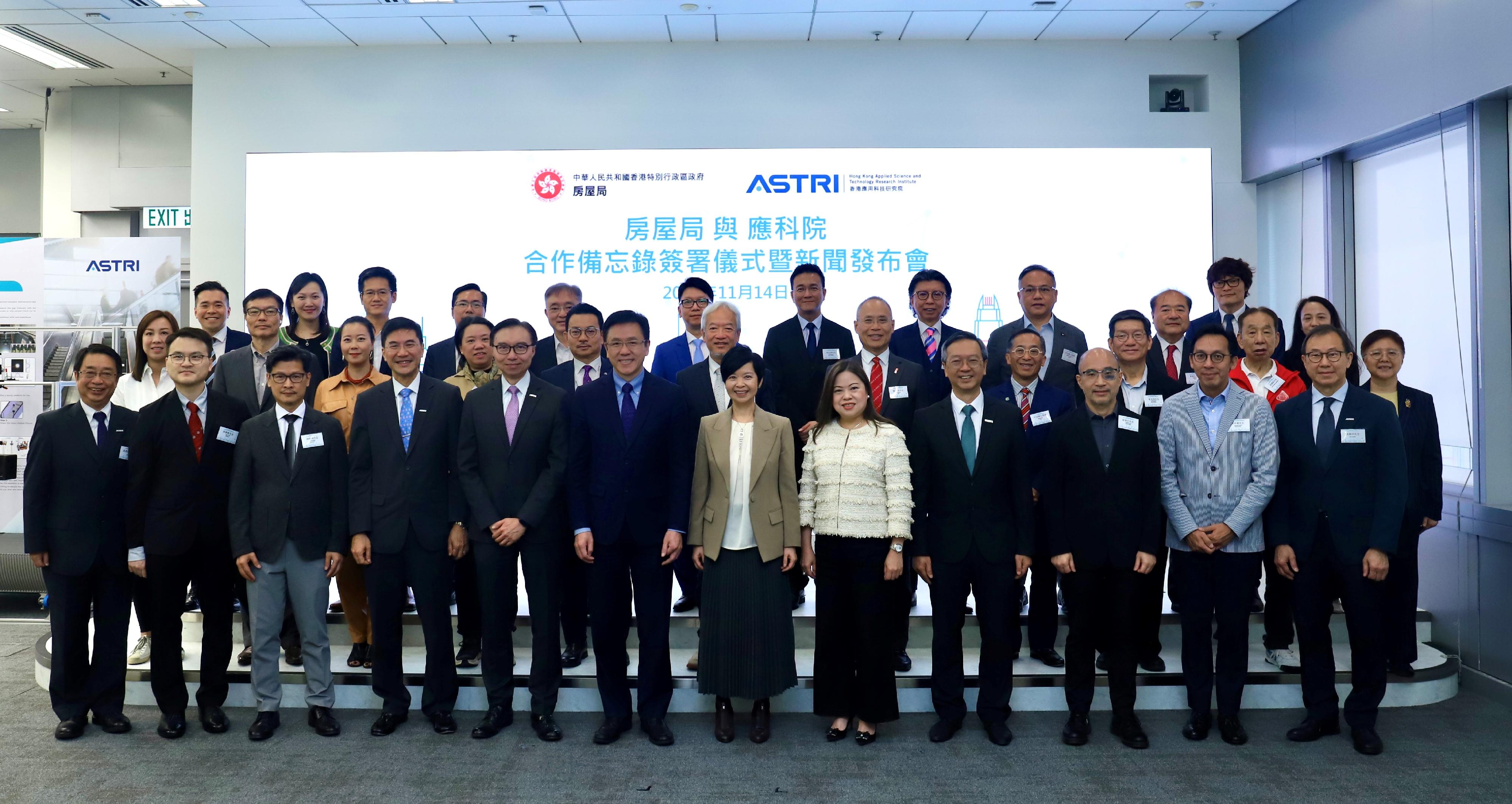 The Housing Bureau and the Hong Kong Applied Science and Technology Research Institute (ASTRI) signed a Memorandum of Understanding today (November 14) to jointly explore innovative solutions and applications for enhancing construction efficiency and safety, as well as optimising property management processes. Pictured are (first row, from fourth left) the Chief Executive Officer of ASTRI, Dr Denis Yip; the Board Chairman of ASTRI, Mr Sunny Lee; the Secretary for Innovation, Technology and Industry, Professor Sun Dong; the Secretary for Housing, Ms Winnie Ho; the Permanent Secretary for Housing/Director of Housing, Miss Rosanna Law; the Under Secretary for Housing, Mr Victor Tai, and other guests at the signing ceremony.
