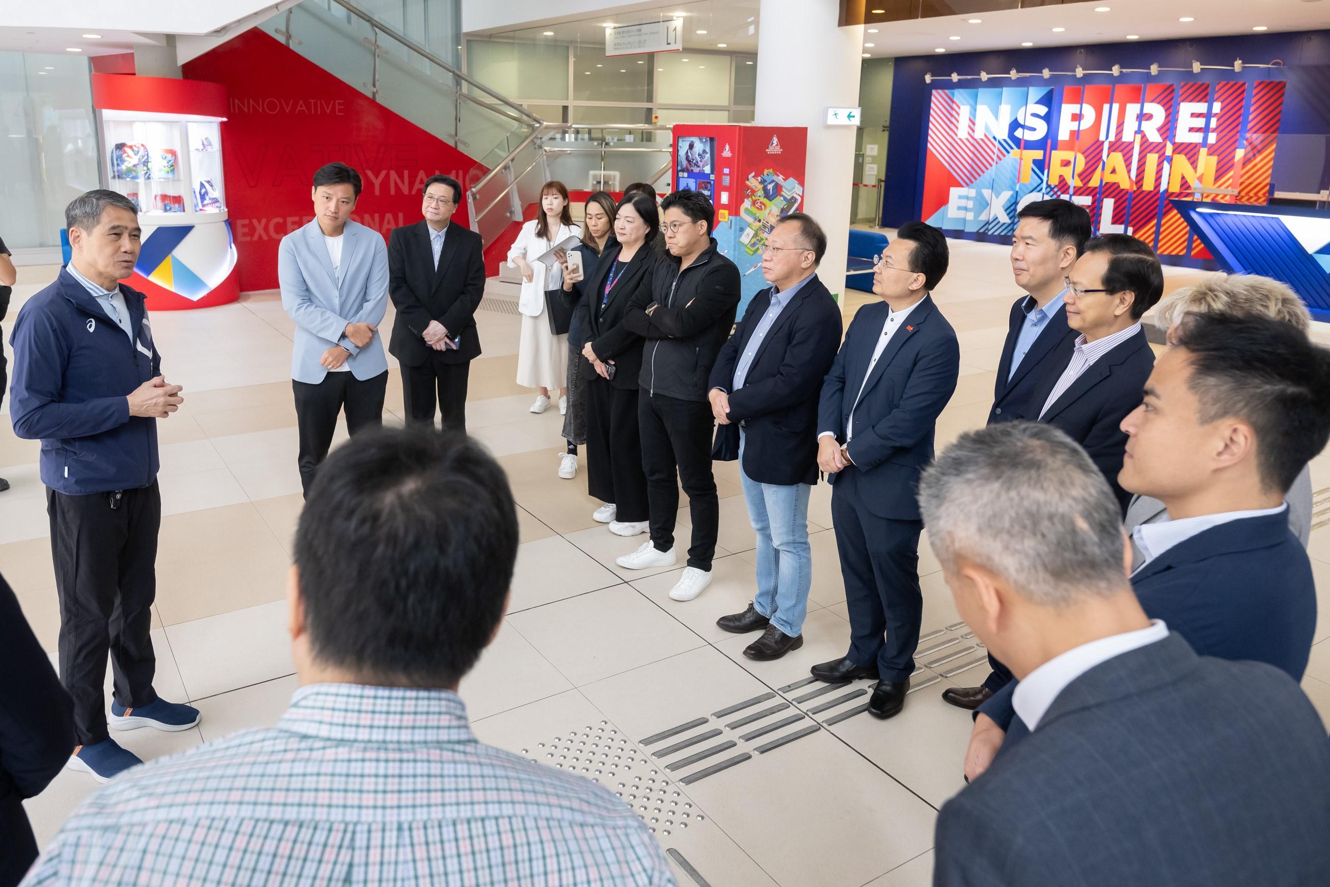 The Legislative Council (LegCo) Panel on Home Affairs, Culture and Sports visited the Hong Kong Sports Institute (HKSI) today (November 14). Photo shows LegCo Members receiving a briefing by the Chairman of the HKSI, Mr Tang King-shing (first left), on the construction progress of the new facilities building.