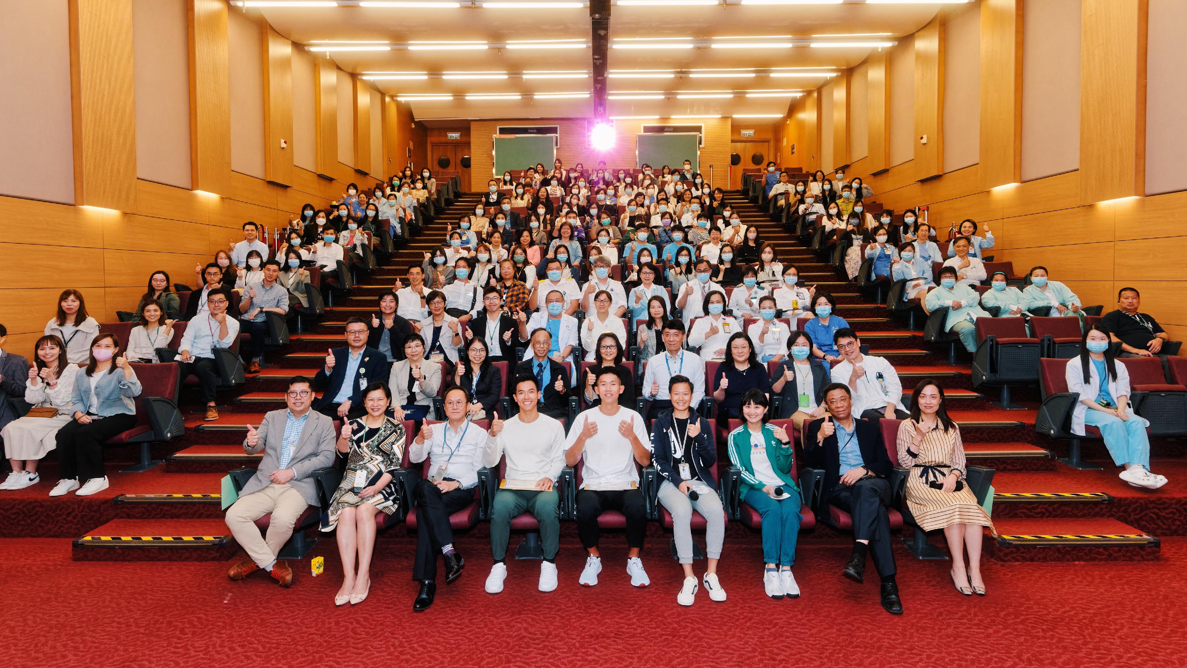 Lam San-tung (first row, fourth left) and Wong Wai-chun (first row, fifth left), who won the gold medal in Rowing Men's Coxless Pairs in the 19th Asian Games Hangzhou, attended a sharing session held at Princess Margaret Hospital on November 13 to share their journey and behind-the-scenes moments of winning the gold medal in the Asian Games.