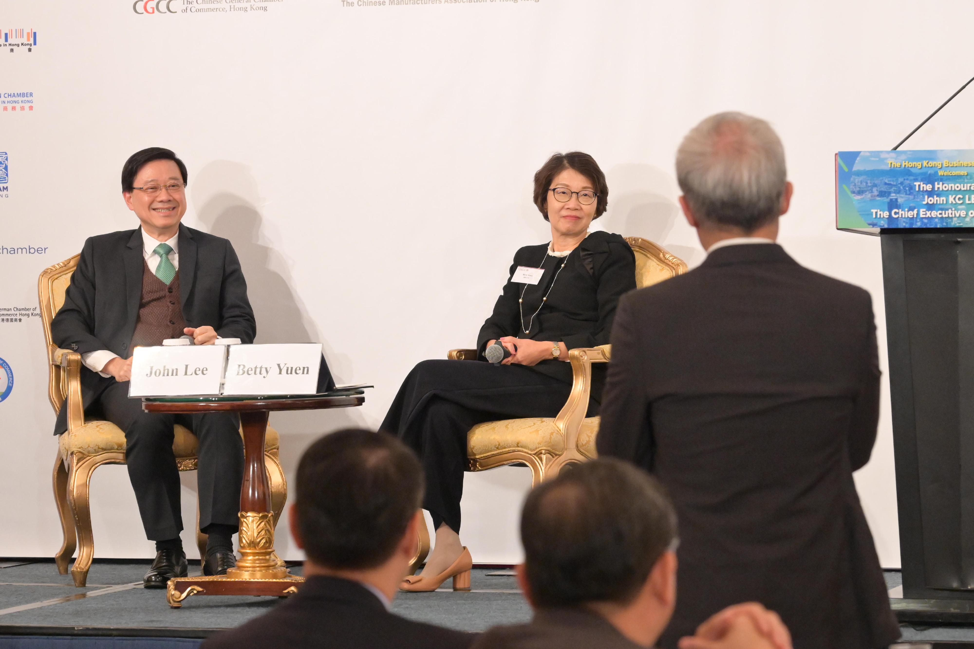 The Chief Executive, Mr John Lee (left), attends the Joint Business Community Luncheon today (November 16). Looking on is the Chairman of the Hong Kong General Chamber of Commerce, Mrs Betty Yuen (right).