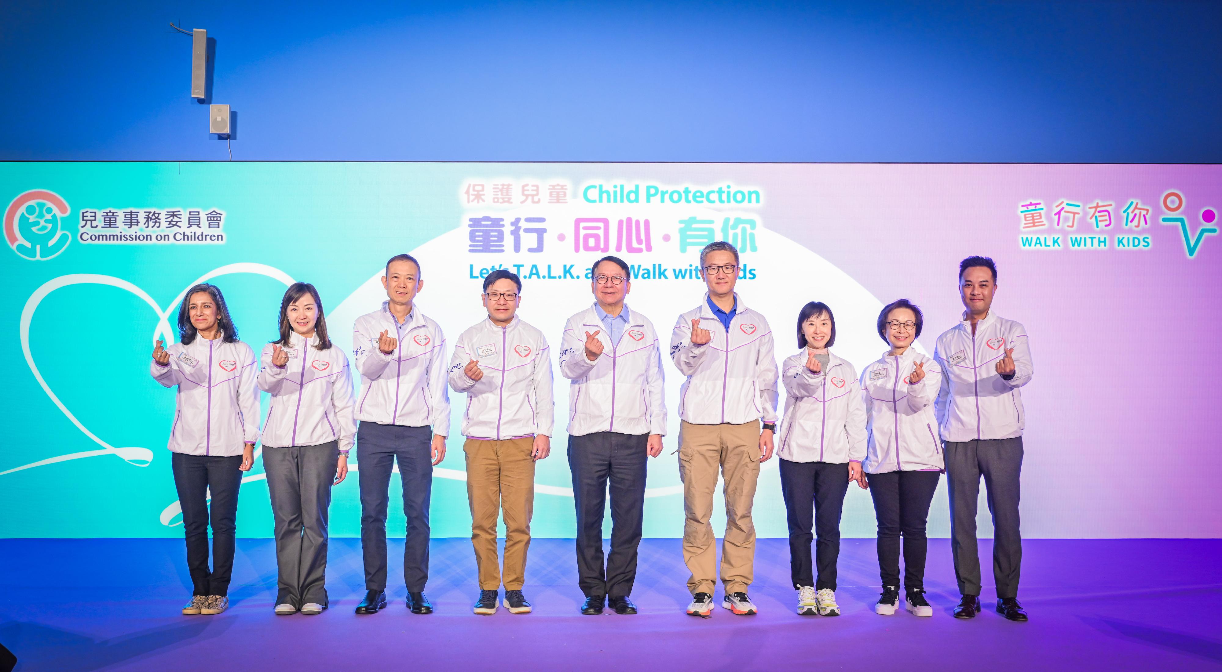 The Chief Secretary for Administration and Chairperson of the Commission on Children, Mr Chan Kwok-ki, today (November 18) officiated at the "Let's T.A.L.K. and Walk with Kids" Child Protection Campaign Award Presentation Ceremony 2023. Photo shows (from left) the Convenor of the Working Group on Children with Specific Needs, Ms Shalini Mahtani; the Convenor of the Working Group on Children Protection, Ms Kathy Chung; the Consultant Community Medicine (Family and Student Health) of the Department of Health, Dr Thomas Chung; the Secretary for Labour and Welfare, Mr Chris Sun; Mr Chan; the Commissioner of Police, Mr Siu Chak-yee; the Director of Social Welfare, Miss Charmaine Lee; the Convenor of the Working Group on Research and Development, Dr Sanly Kam; and the Convenor of the Working Group on Promotion of Children's Rights and Development, Public Education and Engagement, Mr Gary Wong, at the ceremony.