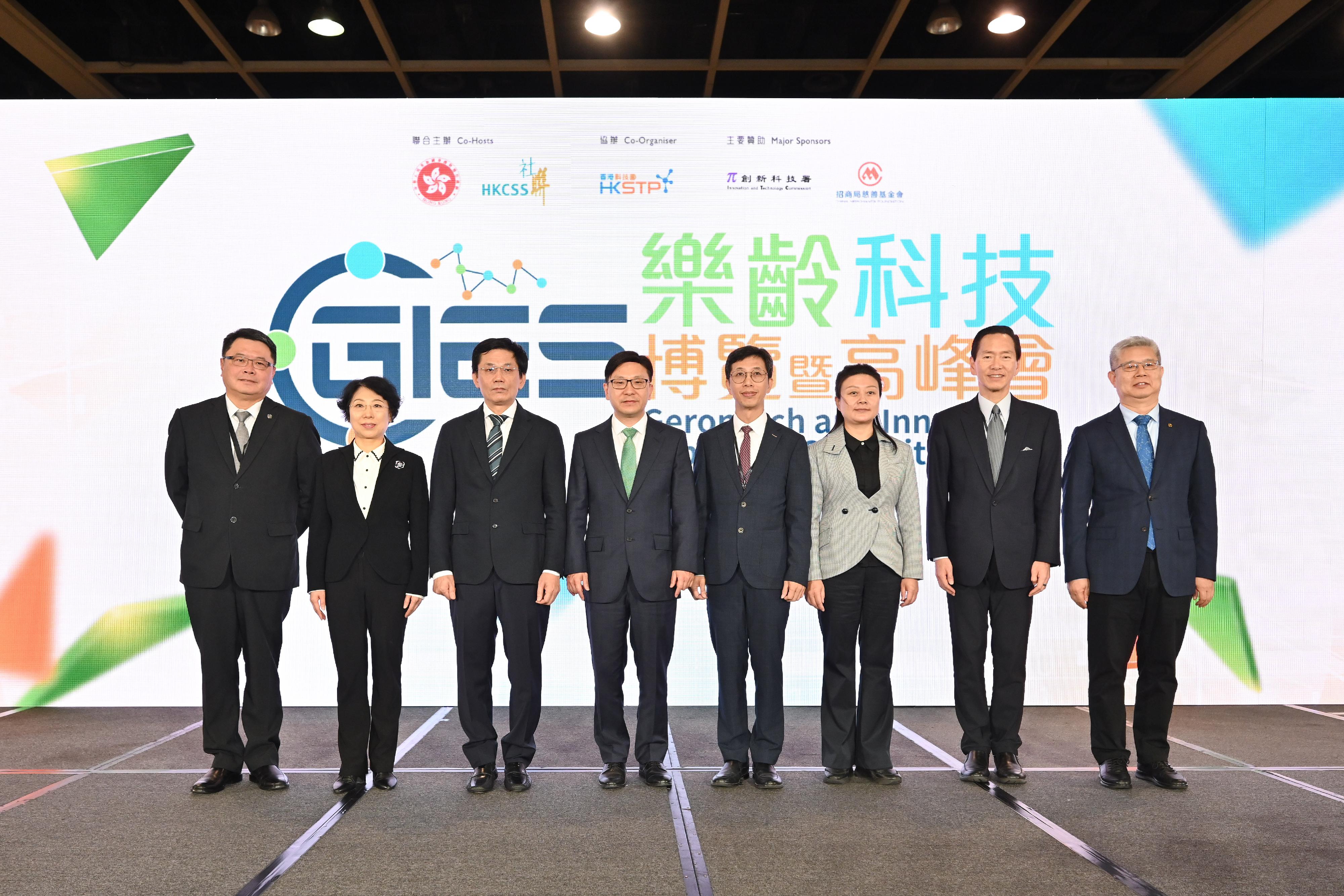 The Secretary for Labour and Welfare, Mr Chris Sun, today (November 23) officiated at the opening ceremony of the Gerontech and Innovation Expo cum Summit 2023 co-hosted by the Government and the Hong Kong Council of Social Service. Photo shows (from left) the Chairman of the Hong Kong Science and Technology Parks Corporation, Dr Sunny Chai; Second-level Inspector of the Guangzhou Municipal Civil Affairs Bureau Ms Yi Lihua; the Deputy Director-General of the Department of Social Affairs of the Liaison Office of the Central People's Government in the Hong Kong Special Administrative Region, Mr Zhou He; Mr Sun; the Director of the Social Welfare Bureau of the Macao Special Administrative Region Government, Mr Hon Wai; the Director-General of the Civil Affairs Bureau of Shenzhen Municipality, Ms Xiong Ying; the Chairperson of the Hong Kong Council of Social Service, Mr Bernard Chan; and the Executive Director of the China Merchants Foundation, Mr Zhang Junli, officiating at the opening ceremony.