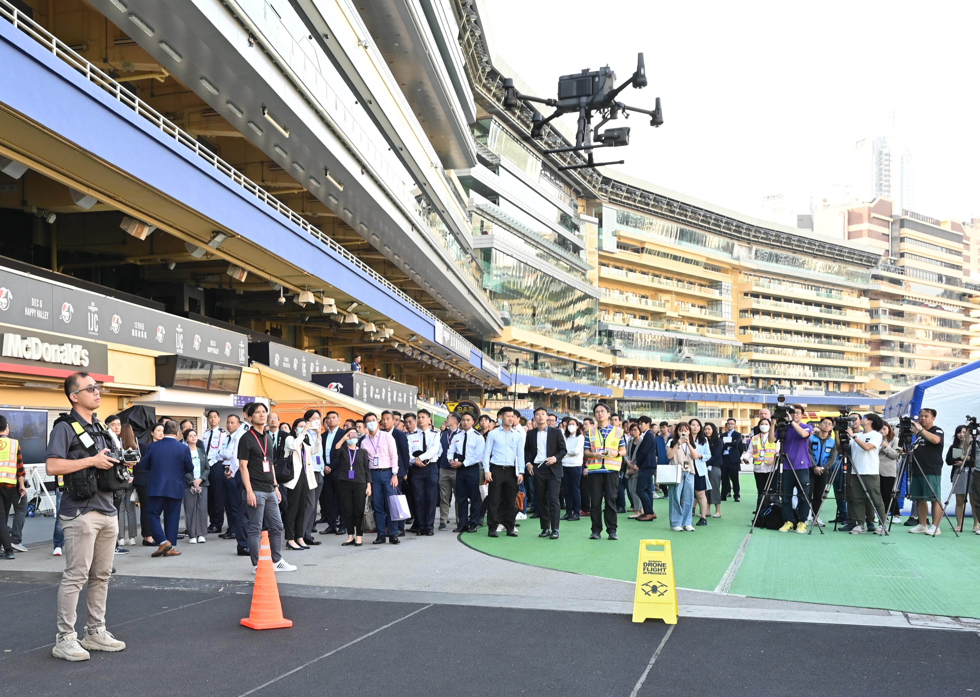 Police Hong Kong Island Regional Headquarters conducted an inter-departmental major incident exercise codenamed "BROKENPIN" with the Fire Services Department, Hospital Authority, Hong Kong Jockey Club, St. John Ambulance Brigade and Hong Kong Association for Conflict and Catastrophe Medicine at Happy Valley Racecourse this afternoon (November 23). Picture shows police officers utilising drones to provide the command post with real-time information.