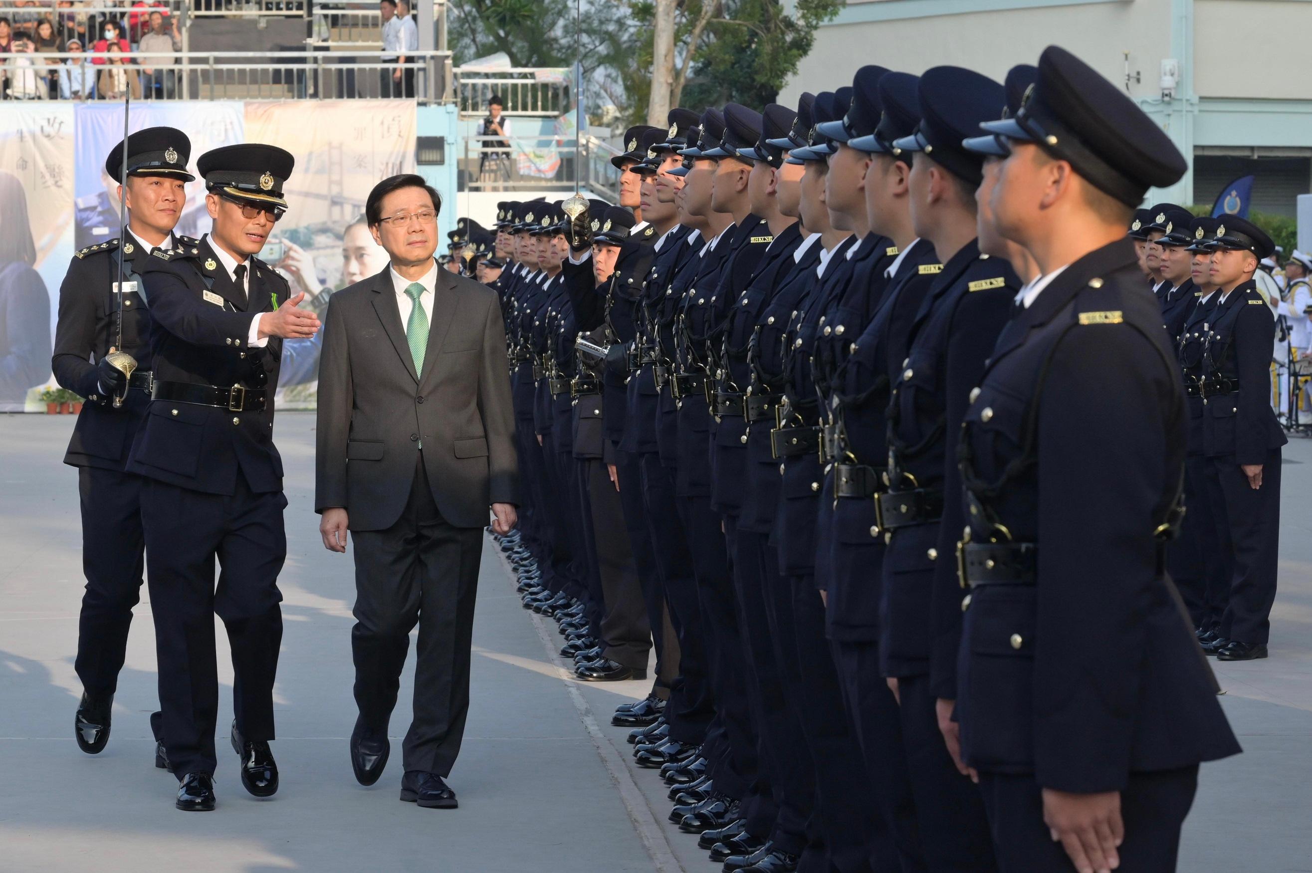 The Chief Executive, Mr John Lee, attended the Correctional Services Department passing-out parade today (November 24). Photo shows Mr Lee (third left) inspecting a contingent of graduates.