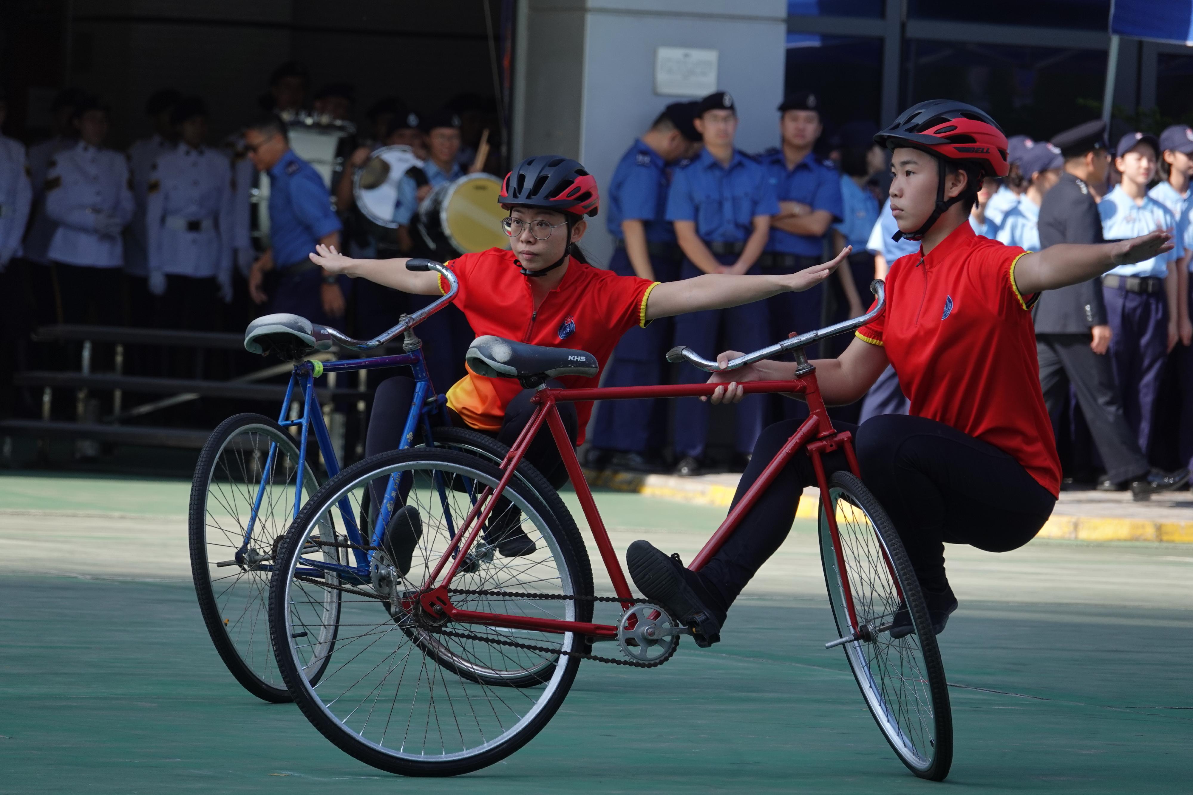 The Civil Aid Service Cadet Corps held the 139th New Cadets Passing-out Parade today (November 25). Photo shows the Cadet Corps Bicycle Demonstration Team performing after the parade.