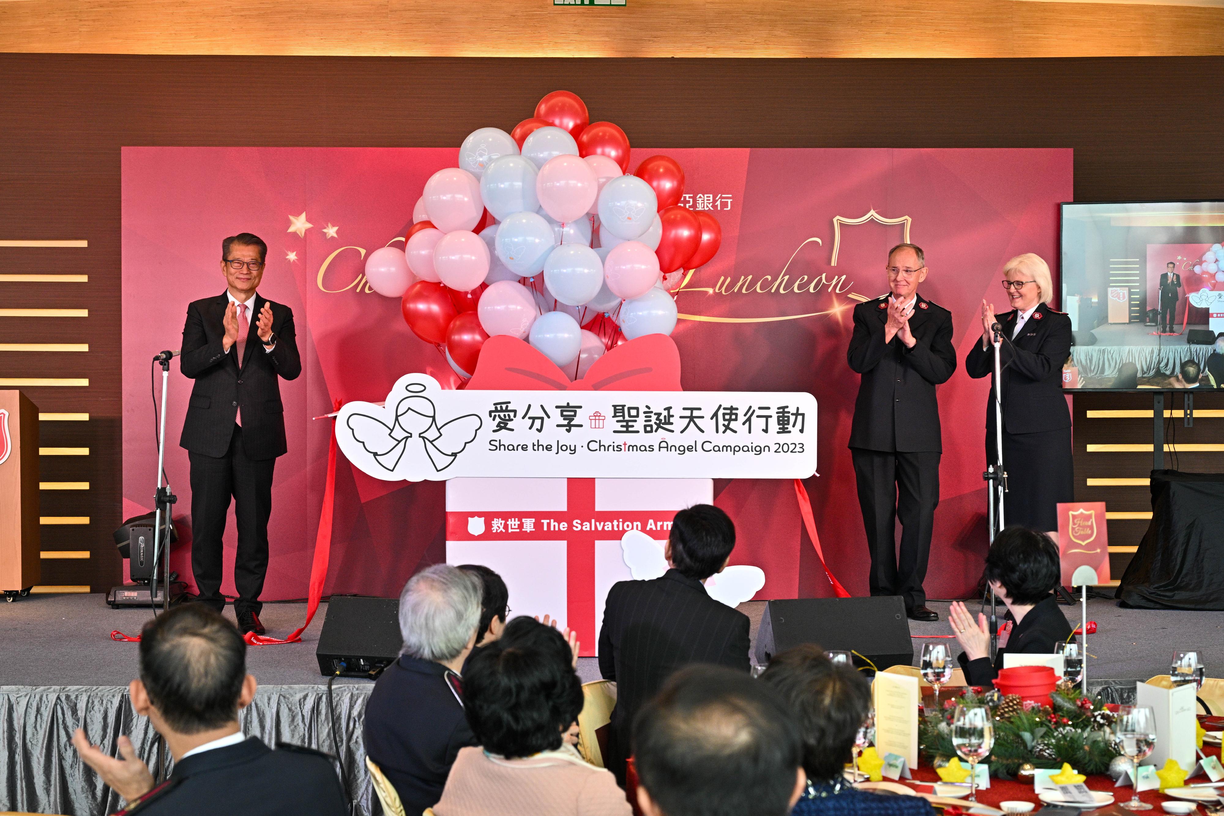 The Financial Secretary, Mr Paul Chan, attended the Salvation Army Charity Christmas Luncheon 2023 today (December 1). Photo shows Mr Chan (first left); the Territorial Commander of the Salvation Army Hong Kong and Macau Command, Colonel Philip Maxwell (second right); and the Territorial President of Women's Ministries of the Salvation Army Hong Kong and Macau Command, Colonel Deslea Maxwell (first right), officiating at the ceremony.
