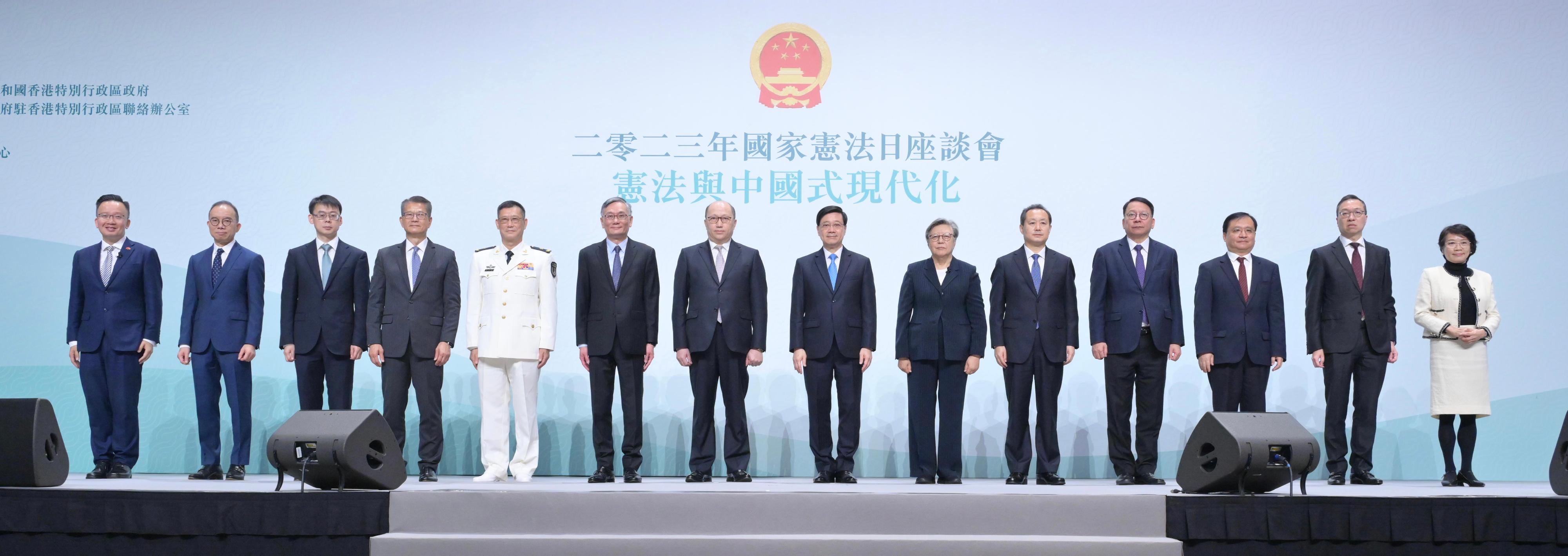 The Chief Executive, Mr John Lee, attended the 2023 Constitution Day Seminar today (December 4). Photo shows (from left) Hong Kong Special Administration Region (HKSAR) Deputy to the National People's Congress (NPC) Mr Nicholas Chan; the Secretary for Constitutional and Mainland Affairs, Mr Erick Tsang Kwok-wai; Professor of Peking University Law School Zhang Xiang; the Financial Secretary, Mr Paul Chan; Political Commissar of the Chinese People's Liberation Army Hong Kong Garrison, Navy Rear Admiral Lai Ruxin; the Chief Justice of the Court of Final Appeal, Mr Andrew Cheung Kui-nung; the Director of the Liaison Office of the Central People's Government in the HKSAR, Mr Zheng Yanxiong; Mr Lee; the Chairman of the Management Committee of the Endeavour Education Centre, Mrs Rita Fan; the Head of the Office for Safeguarding National Security of the Central People's Government in the HKSAR, Mr Dong Jingwei; the Chief Secretary for Administration, Mr Chan Kwok-ki; Deputy Commissioner of the Office of the Commissioner of the Ministry of Foreign Affairs of the People's Republic of China in the HKSAR Mr Fang Jianming; the Secretary for Justice, Mr Paul Lam, SC; and member of the HKSAR Basic Law Committee of the Standing Committee of the NPC and member of the Legislative Council, Professor Priscilla Leung at the seminar.
