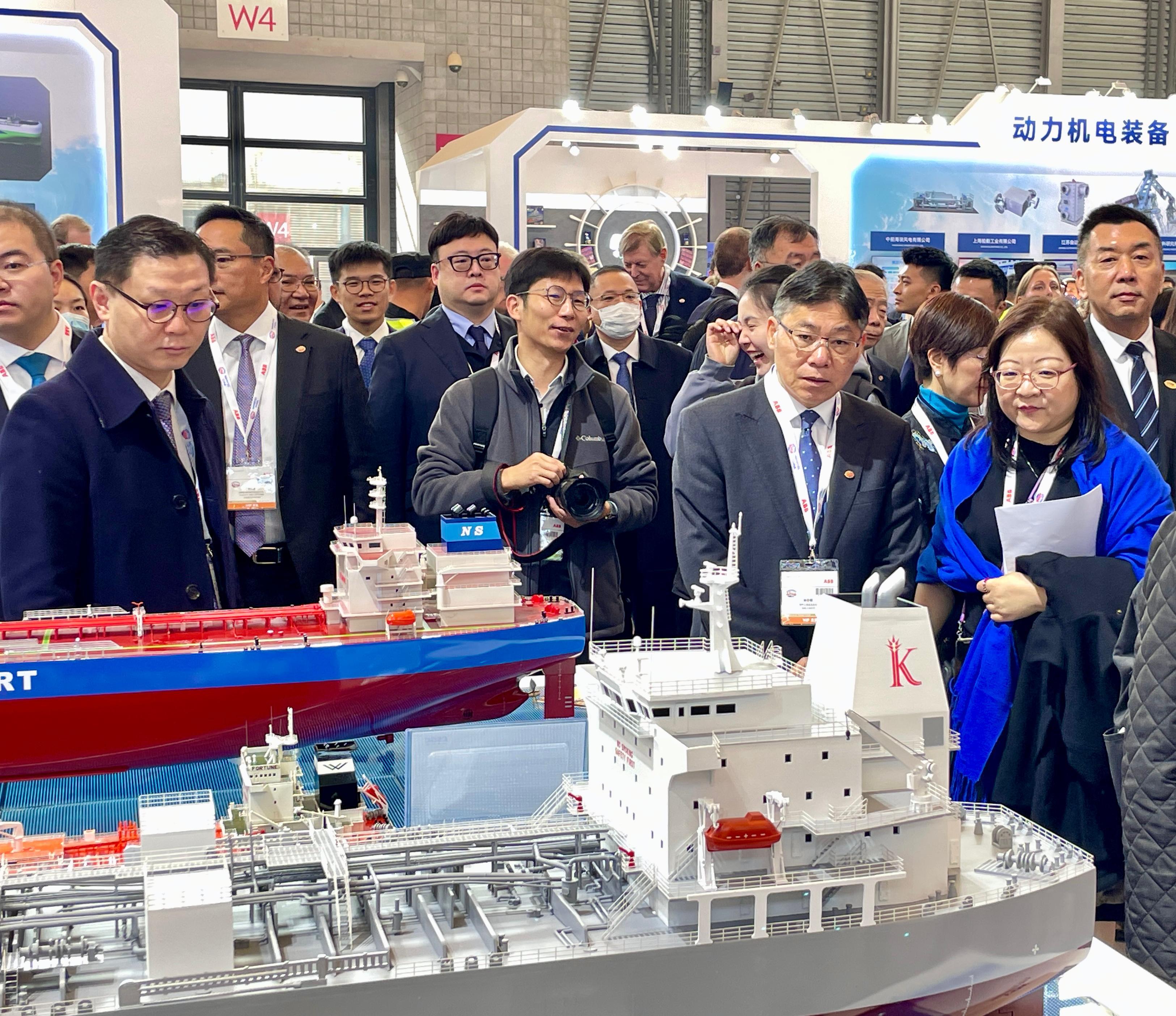 The Chairman of the Hong Kong Maritime and Port Board (HKMPB) and Secretary for Transport and Logistics, Mr Lam Sai-hung (front, second right), leads members of the HKMPB and industry representatives to visit the Marintec China 2023 in Shanghai today (December 5) and learn about the latest developments of the shipbuilding industry.
