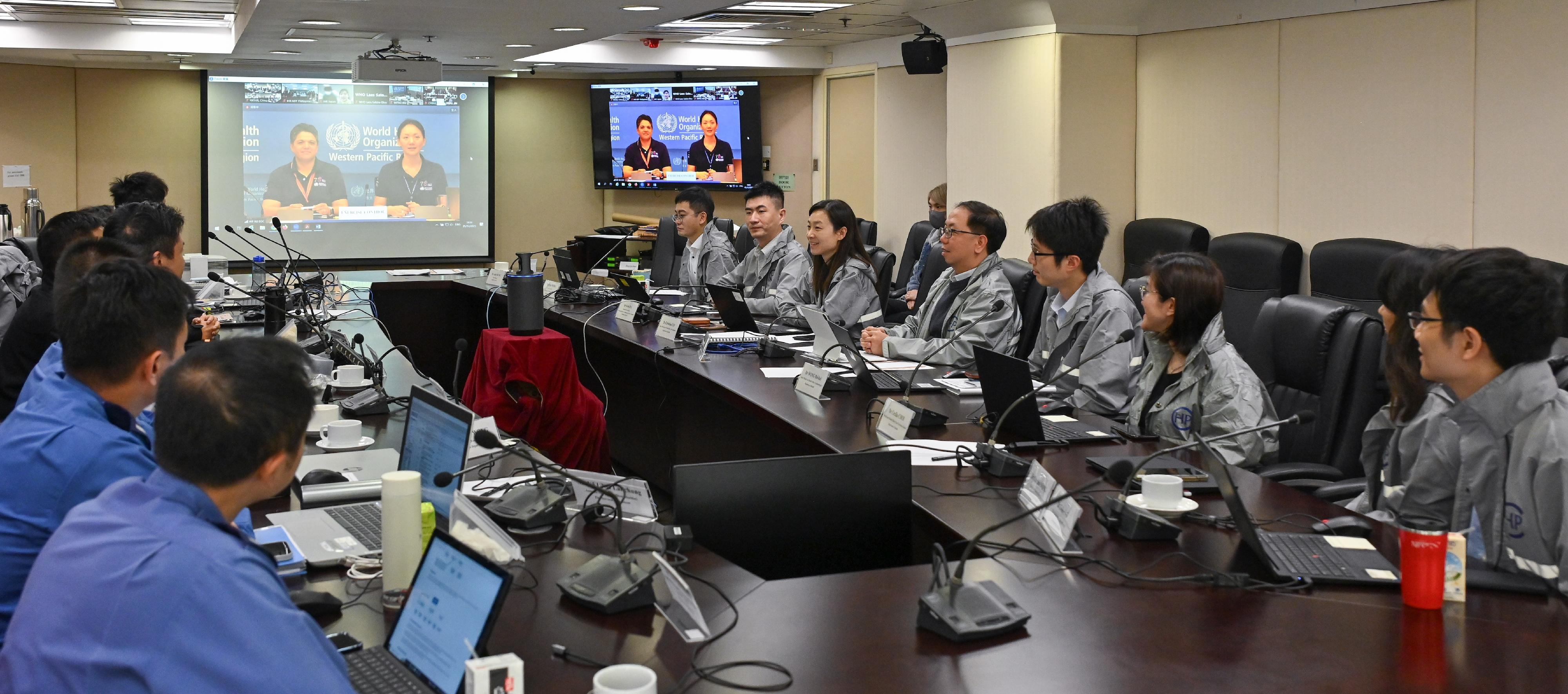The Department of Health, together with the Security Bureau, the Hong Kong Police Force, the Fire Services Department and the Hospital Authority today (December 5) participated in the annual International Health Regulations Exercise Crystal organised by the World Health Organization's Regional Office for the Western Pacific (WPRO) to enhance public health emergency preparedness and response systems. Photo shows a debriefing with experience sharing by participants led by the WPRO.