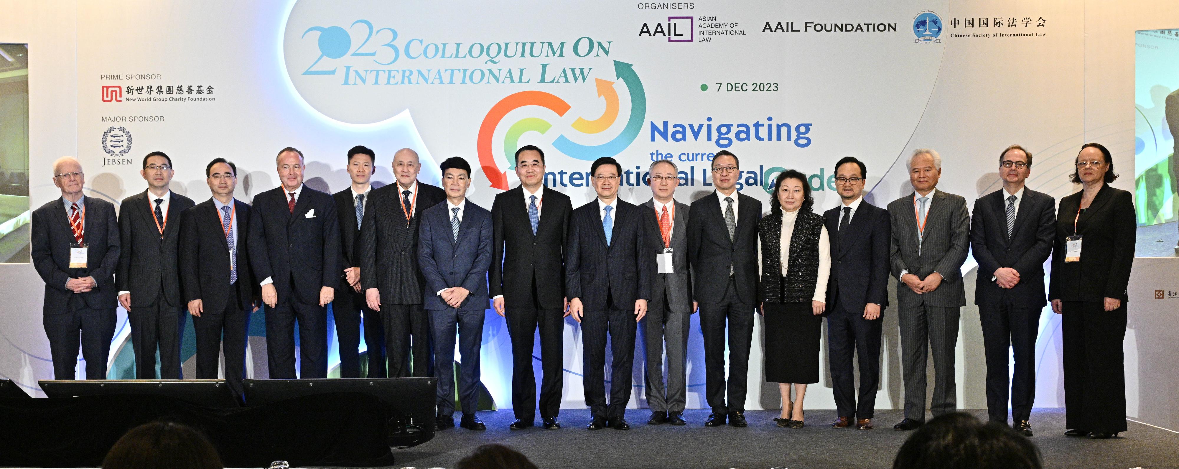 The Chief Executive, Mr John Lee, attended the 2023 Colloquium on International Law today (December 7). Photo shows Mr Lee (eighth right); the Acting Commissioner of the Office of the Commissioner of the Ministry of Foreign Affairs of the People's Republic of China in the Hong Kong Special Administrative Region, Mr Li Yongsheng (seventh right); the Director-General of the Department of Treaty and Law of the Ministry of Foreign Affairs, Mr Ma Xinmin (eighth left); the Secretary for Justice, Mr Paul Lam, SC (sixth right); Co-Chairman of the Asian Academy of International Law Ms Teresa Cheng, SC (fifth right); Co-Chairman of the Asian Academy of International Law Dr Anthony Neoh (sixth left); the President of the Chinese Society of International Law, Professor Huang Jin (third left); the Secretary-General of the Asian-African Legal Consultative Organization, Dr Kamalinne Pinitpuvadol (seventh left), and other guests at the colloquium.