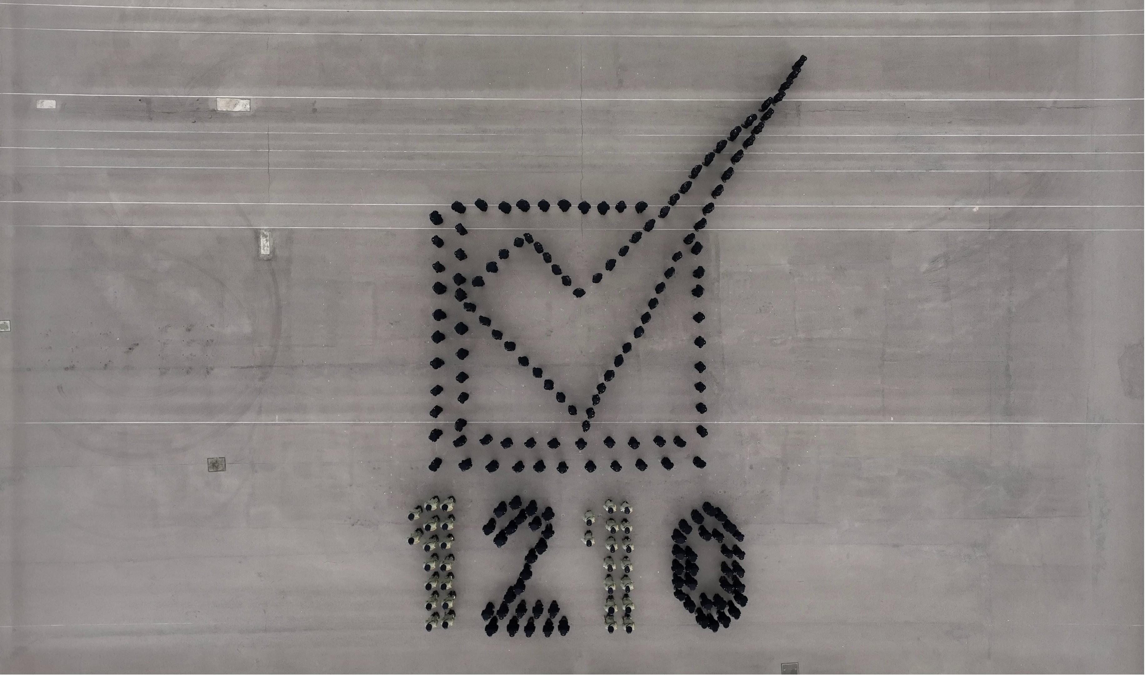 Hong Kong Customs Passing-out Parade was held today (December 8). Photo shows the parade forming a pattern that represents the District Council election.

