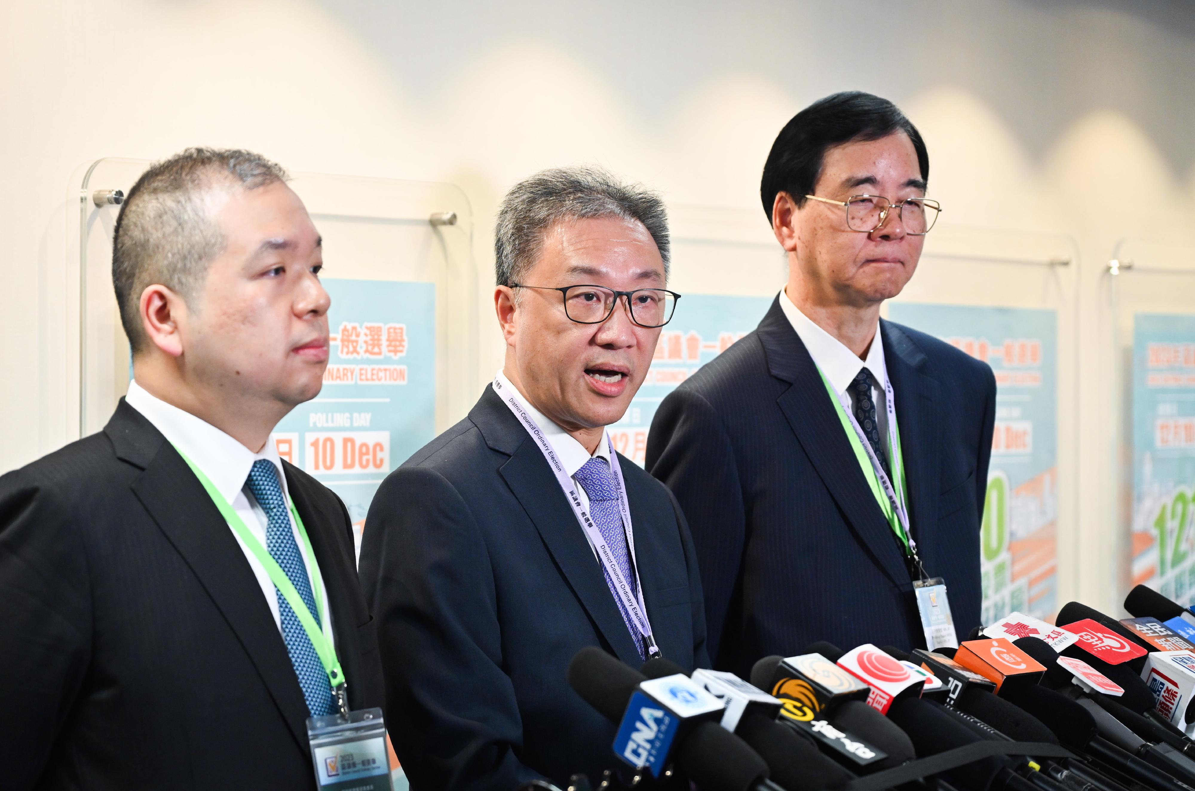 The Chairman of the Electoral Affairs Commission (EAC), Mr Justice David Lok (centre), EAC members Professor Daniel Shek (right) and Mr Bernard Man, SC (left), meet the media on the 2023 District Council Ordinary Election this afternoon (December 10).