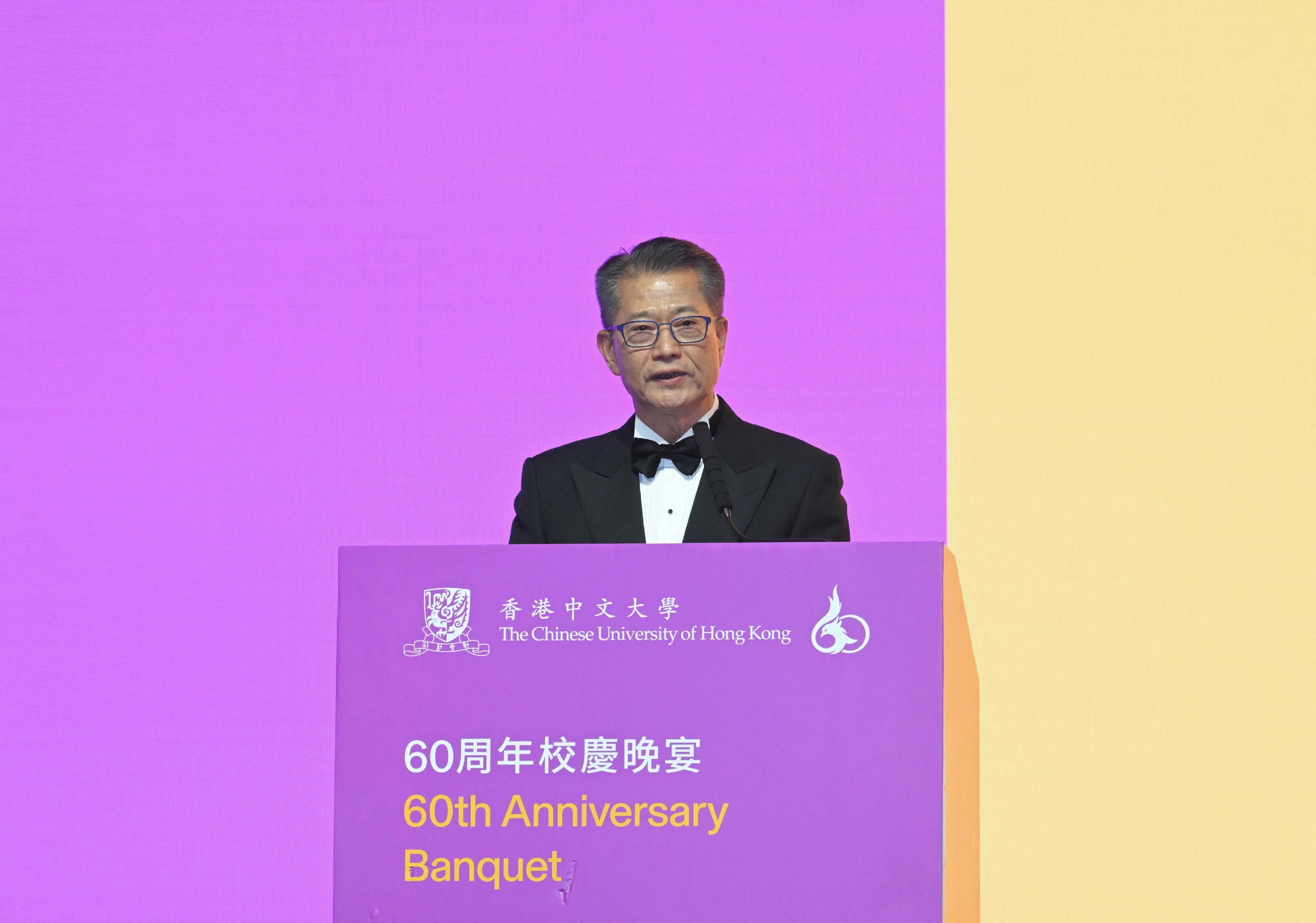 The Financial Secretary, Mr Paul Chan, speaks at the Chinese University of Hong Kong 60th Anniversary Banquet today (December 10).
