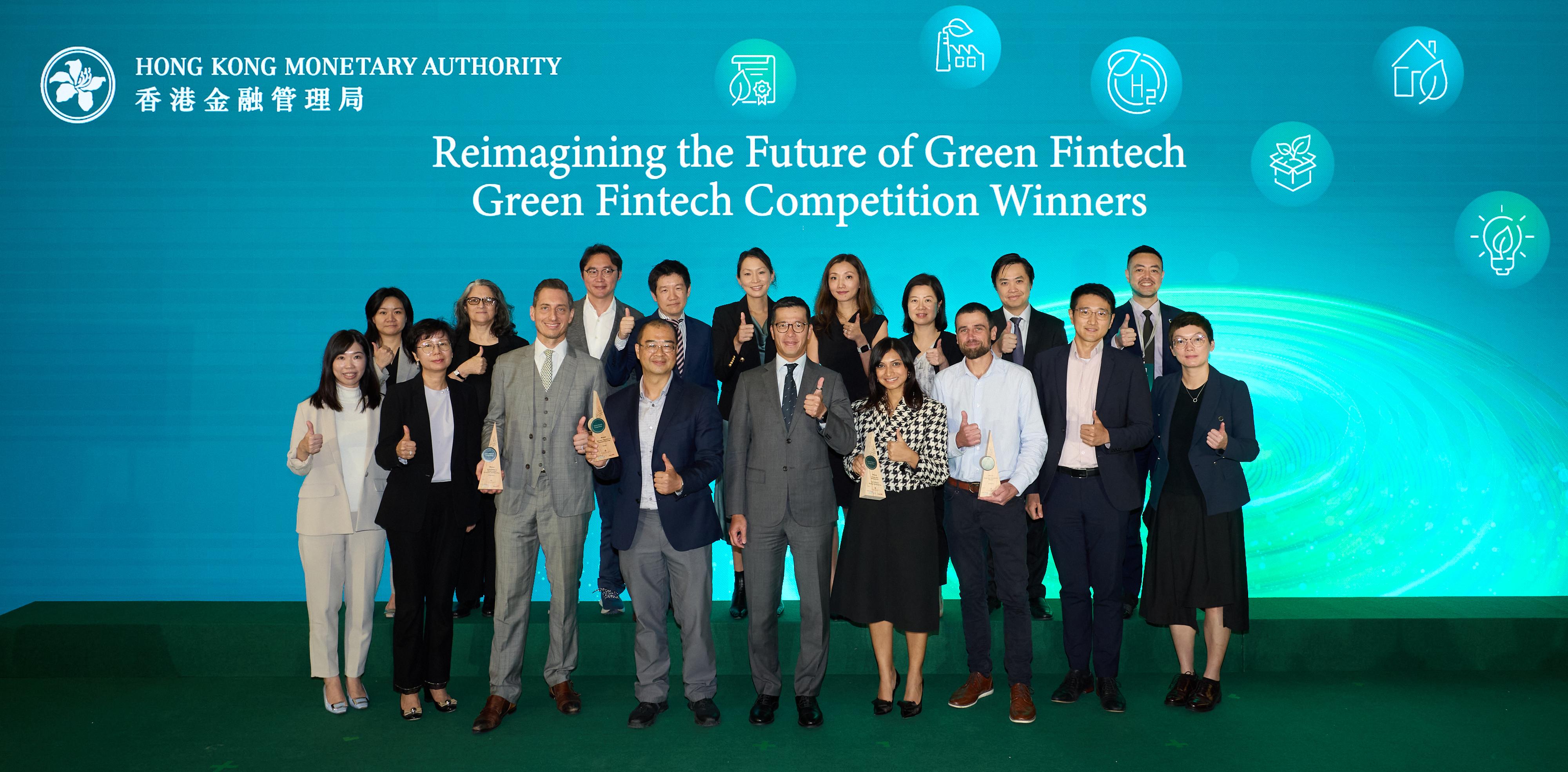 The Hong Kong Monetary Authority (HKMA) organised the Green and Sustainable Banking Conference today (December 11). The Executive Director (Banking Policy) of the HKMA, Mr Donald Chen, presents the awards to the winners of the Green Fintech Competition at the Green and Sustainable Banking Conference. The photo shows Mr Chen (front row, centre), the winners and the judging panel. 