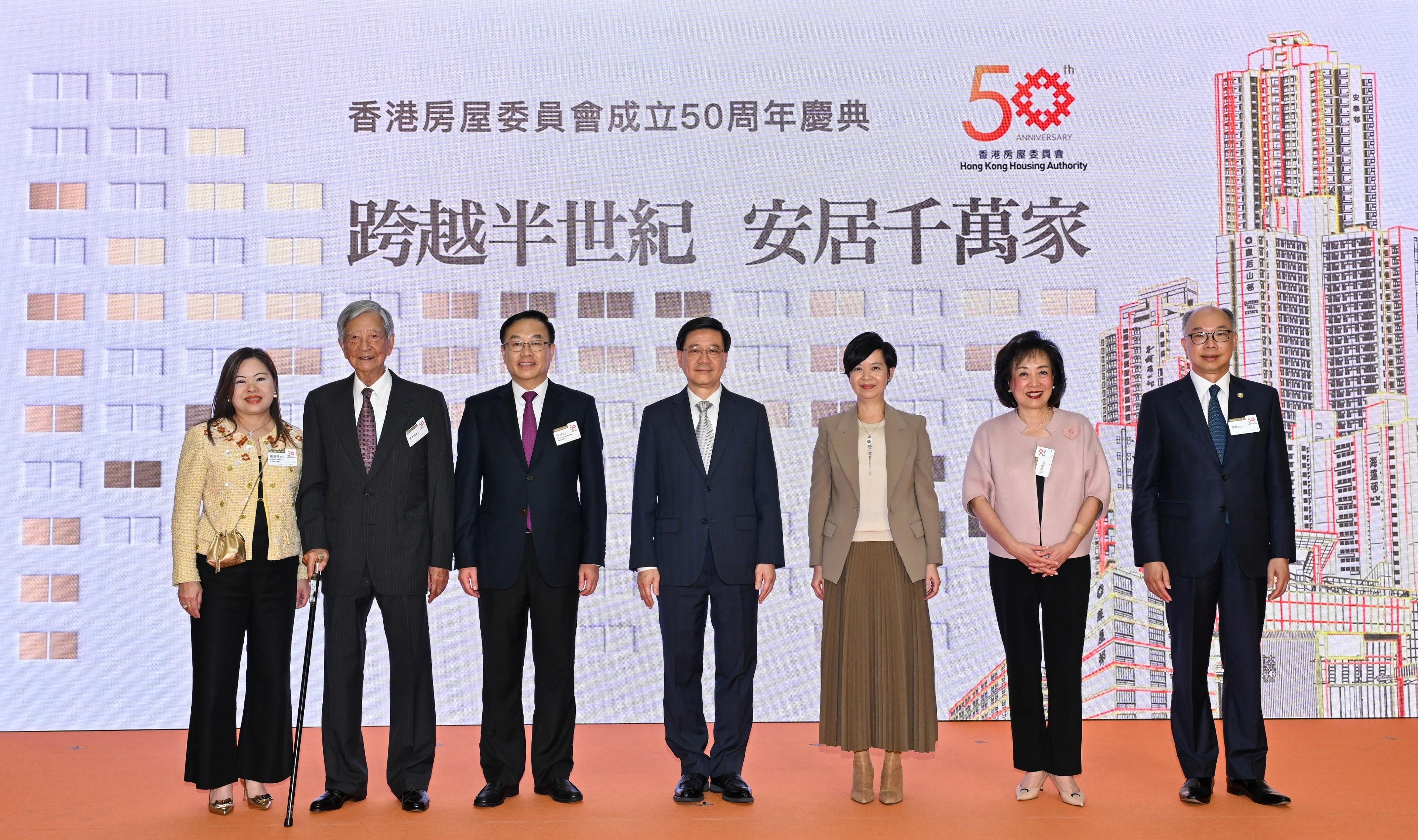 The Chief Executive, Mr John Lee, attended the Hong Kong Housing Authority (HA) 50th anniversary celebration ceremony today (December 12). Photo shows Mr Lee (centre); Deputy Director of the Liaison Office of the Central People's Government in the Hong Kong Special Administrative Region Mr He Jing (third left); the Secretary for Housing and Chairman of the HA, Ms Winnie Ho (third right); the Permanent Secretary for Housing/Director of Housing, Miss Rosanna Law (first left), and other guests at the ceremony. 