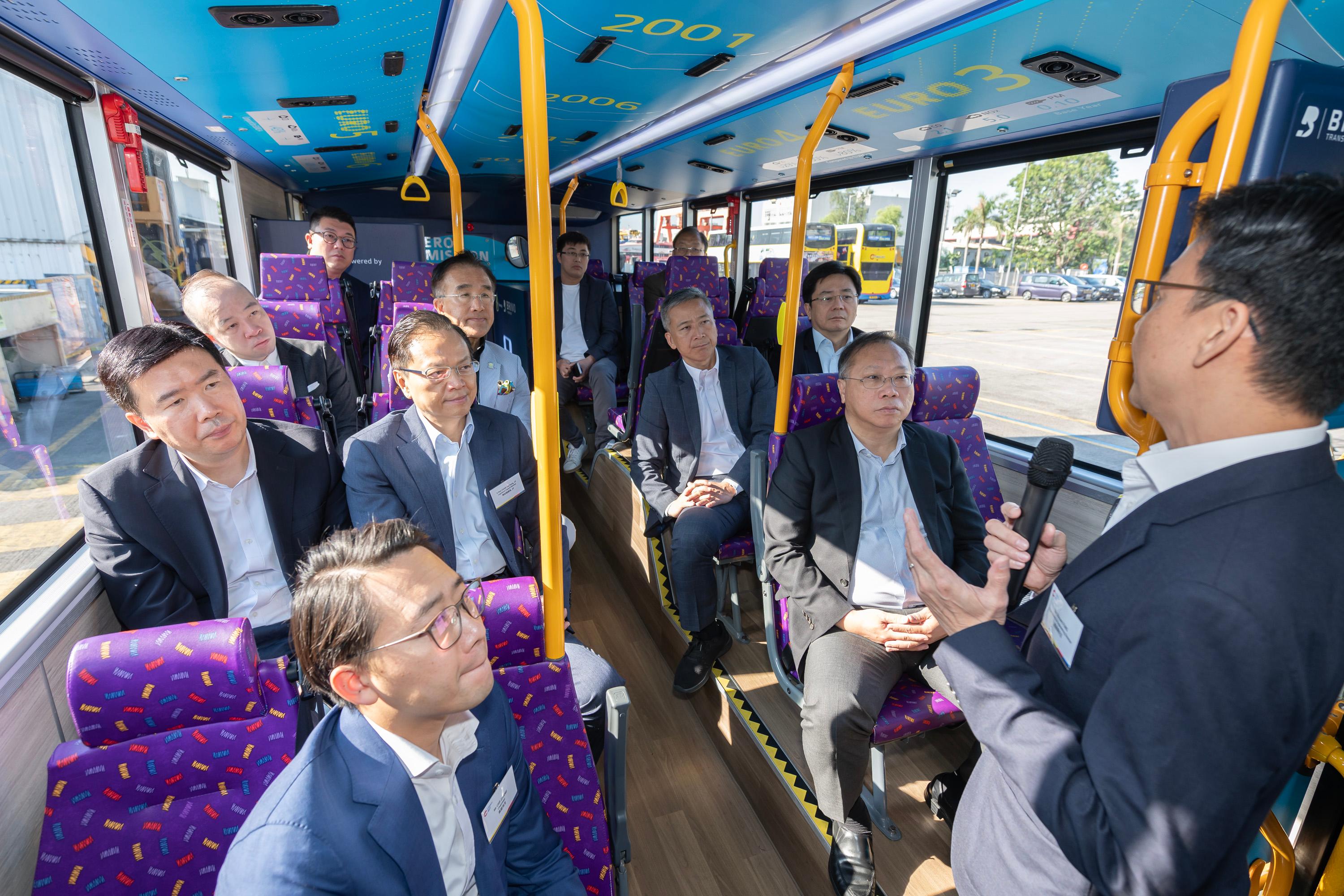The Legislative Council Panel on Environmental Affairs and Panel on Transport conducted a joint visit to the Citybus Hydrogen Refuelling Station and its hydrogen bus today (December 12). Photo shows Members receiving a briefing by the Citybus management on the company's development direction.