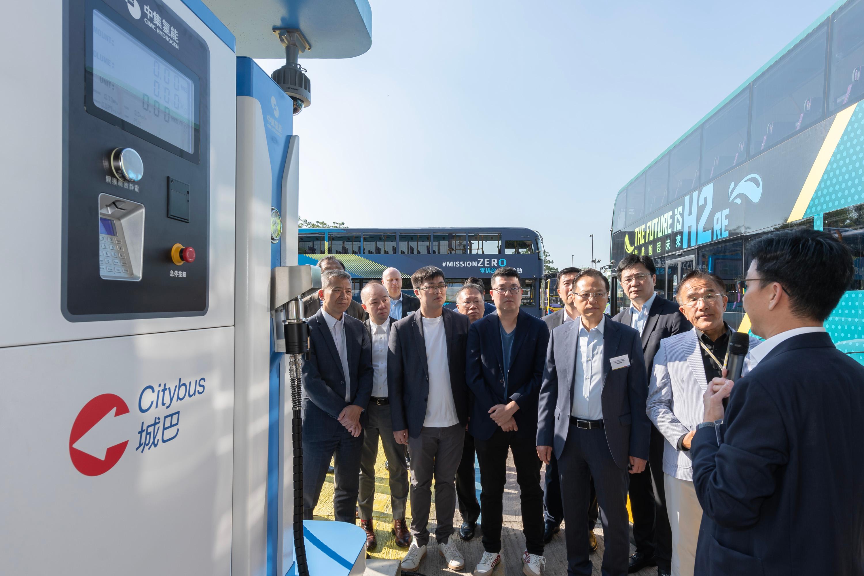 The Legislative Council Panel on Environmental Affairs and Panel on Transport conducted a joint visit to the Citybus Hydrogen Refuelling Station and its hydrogen bus today (December 12). Photo shows Members observing Hong Kong's first hydrogen refuelling station.