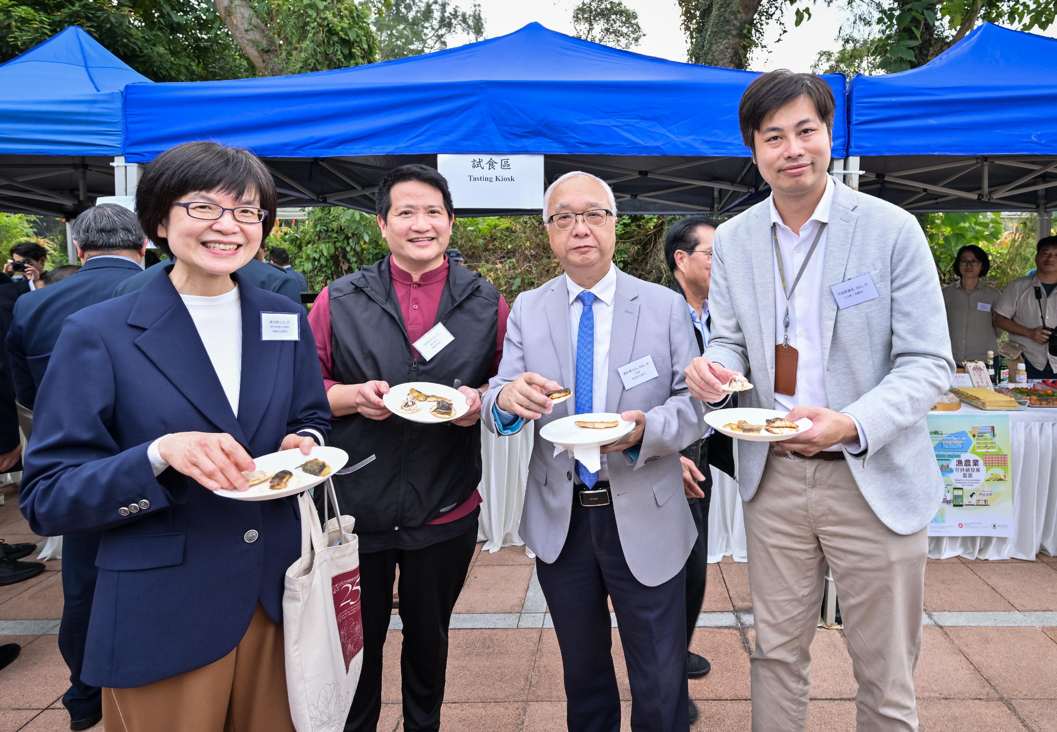 The Government today (December 14) released the Blueprint for the Sustainable Development of Agriculture and Fisheries. Picture shows the Secretary for Environment and Ecology, Mr Tse Chin-wan (second right); the Permanent Secretary for Environment and Ecology (Food), Miss Vivian Lau (first left); and the Legislative Council Member Mr Steven Ho (first right), tasting the agriculture and fisheries’ products. 
