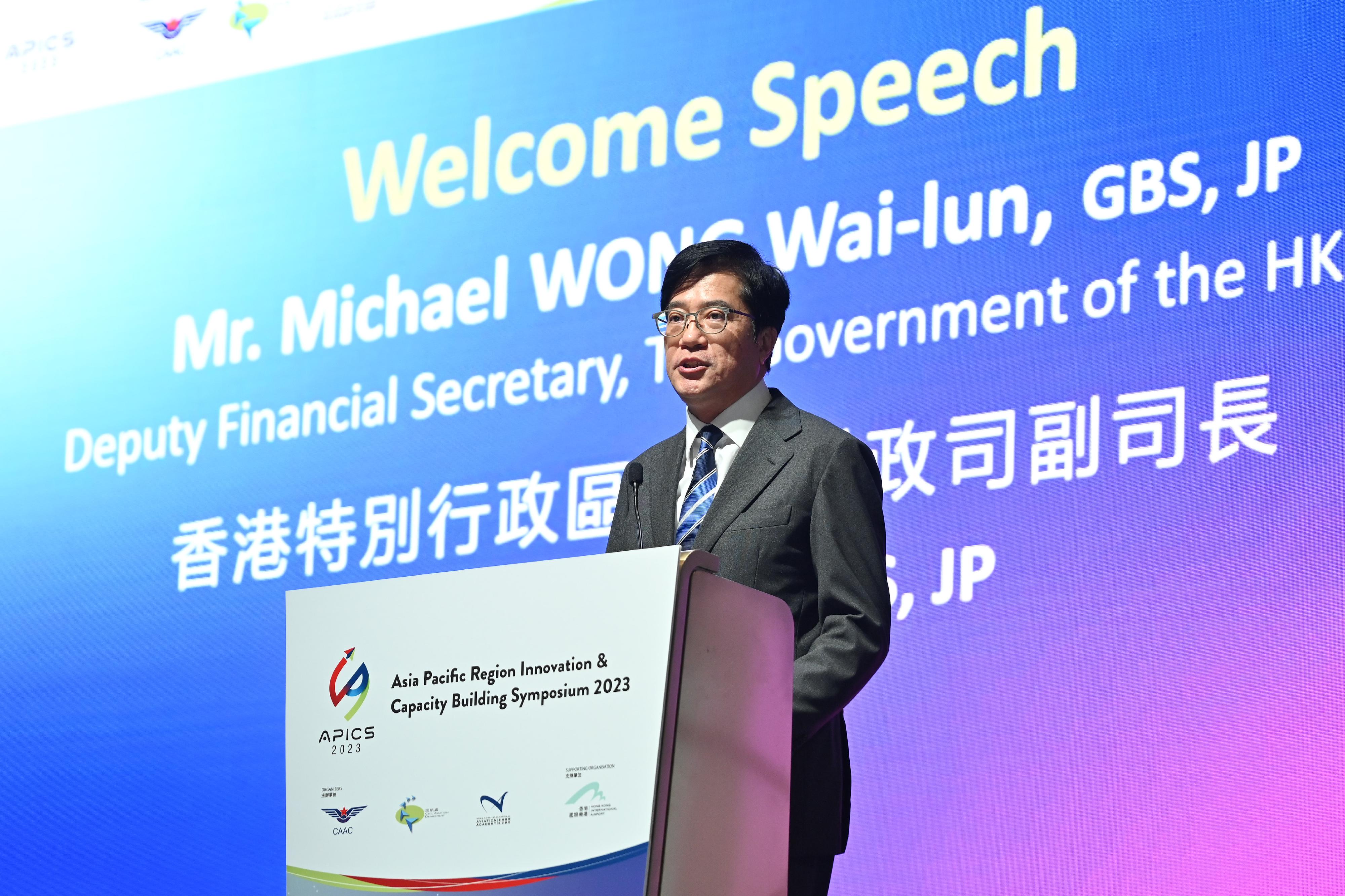 The Asia Pacific Region Innovation & Capacity Building Symposium 2023 (APICS 2023) commenced today (December 14). Photo shows the Deputy Financial Secretary, Mr Michael Wong, delivering opening remarks at the APICS 2023 opening ceremony.