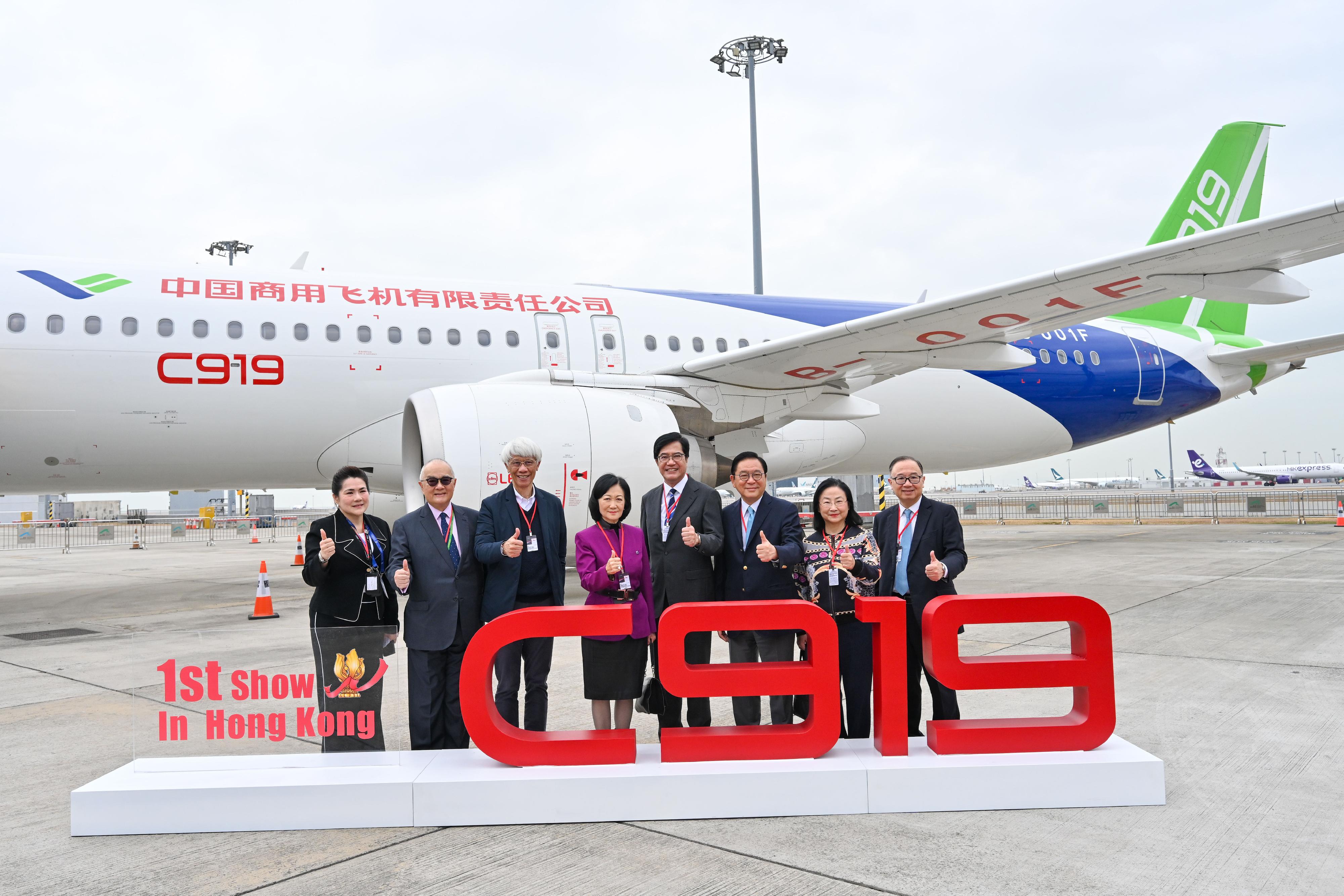 Non-official Members of the Executive Council (ExCo Non-official Members) today (December 14) visited the home-developed aircraft C919 and ARJ21. Photo shows the ExCo Non-official Members with the Deputy Financial Secretary, Mr Michael Wong (fourth right), and the General Manager of Business Aviation Centre Ltd, Ms Madonna Fung (first left), in front of aircraft C919.