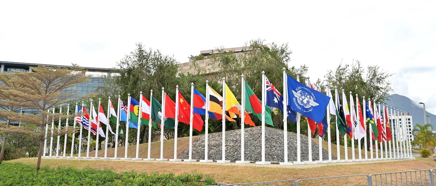 The Hong Kong Civil Aviation Department (CAD) hosted two meetings of the International Civil Aviation Organization at its headquarters, namely the 34th Meeting of the Asia Pacific Air Navigation Planning and Implementation Regional Group from December 11 to 13, and the 13th Meeting of Regional Aviation Safety Group - Asia Pacific Regions on December 18 and 19.  Photo shows flags of participating states and administrations and international organisations flying at the Hong Kong CAD Headquarters. 