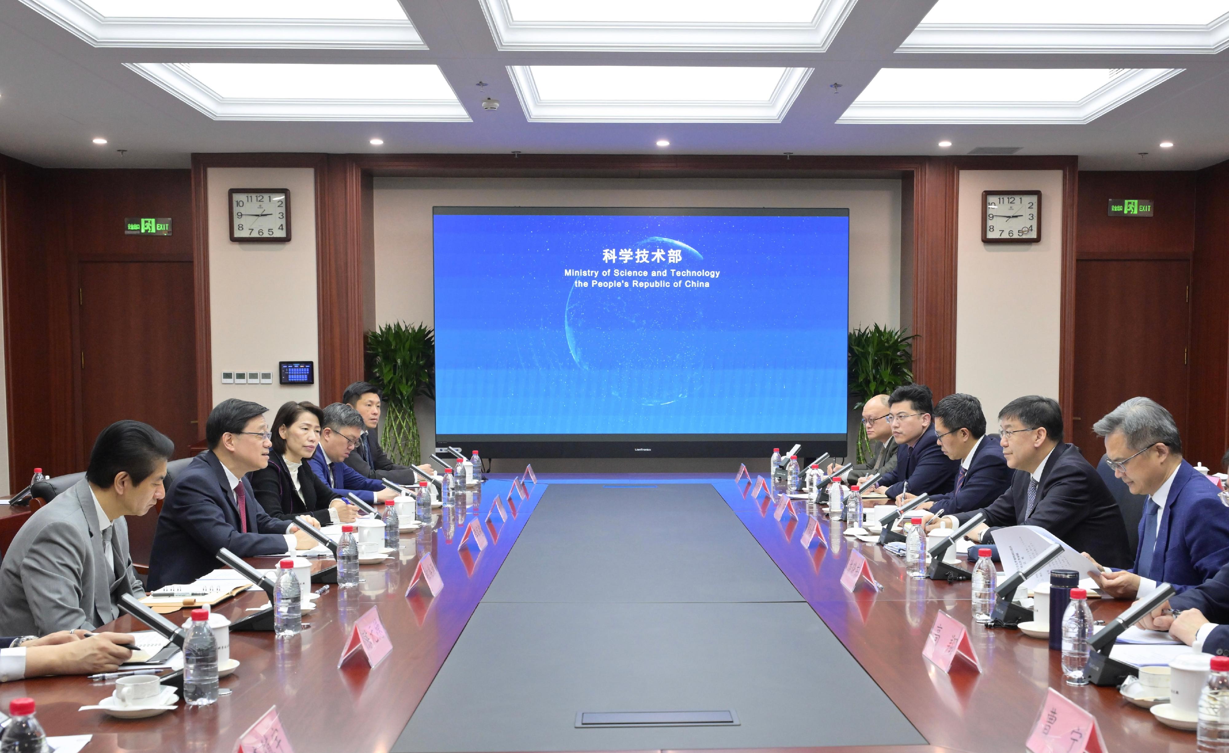The Chief Executive, Mr John Lee (second left), meets with the Minister of Science and Technology, Mr Yin Hejun (second right), in Beijing today (December 19). The Director of the Chief Executive's Office, Ms Carol Yip (third left), and the Director of the Office of the Government of the Hong Kong Special Administrative Region in Beijing, Mr Rex Chang (first left), also attend. 