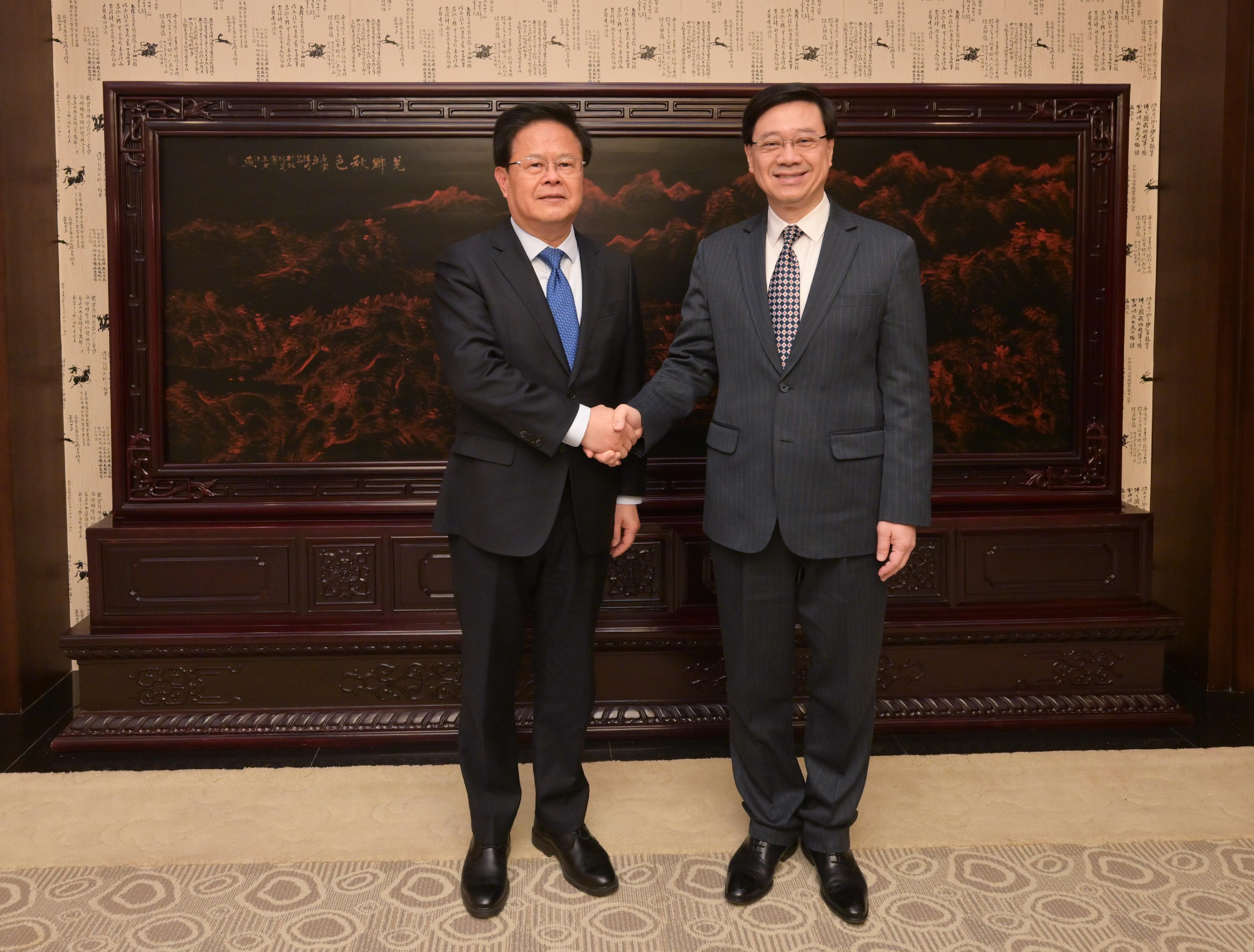The Chief Executive, Mr John Lee (right), meets with the Party Secretary and Chairman of the National Development and Reform Commission, Mr Zheng Shanjie (left), in Beijing today (December 20). 