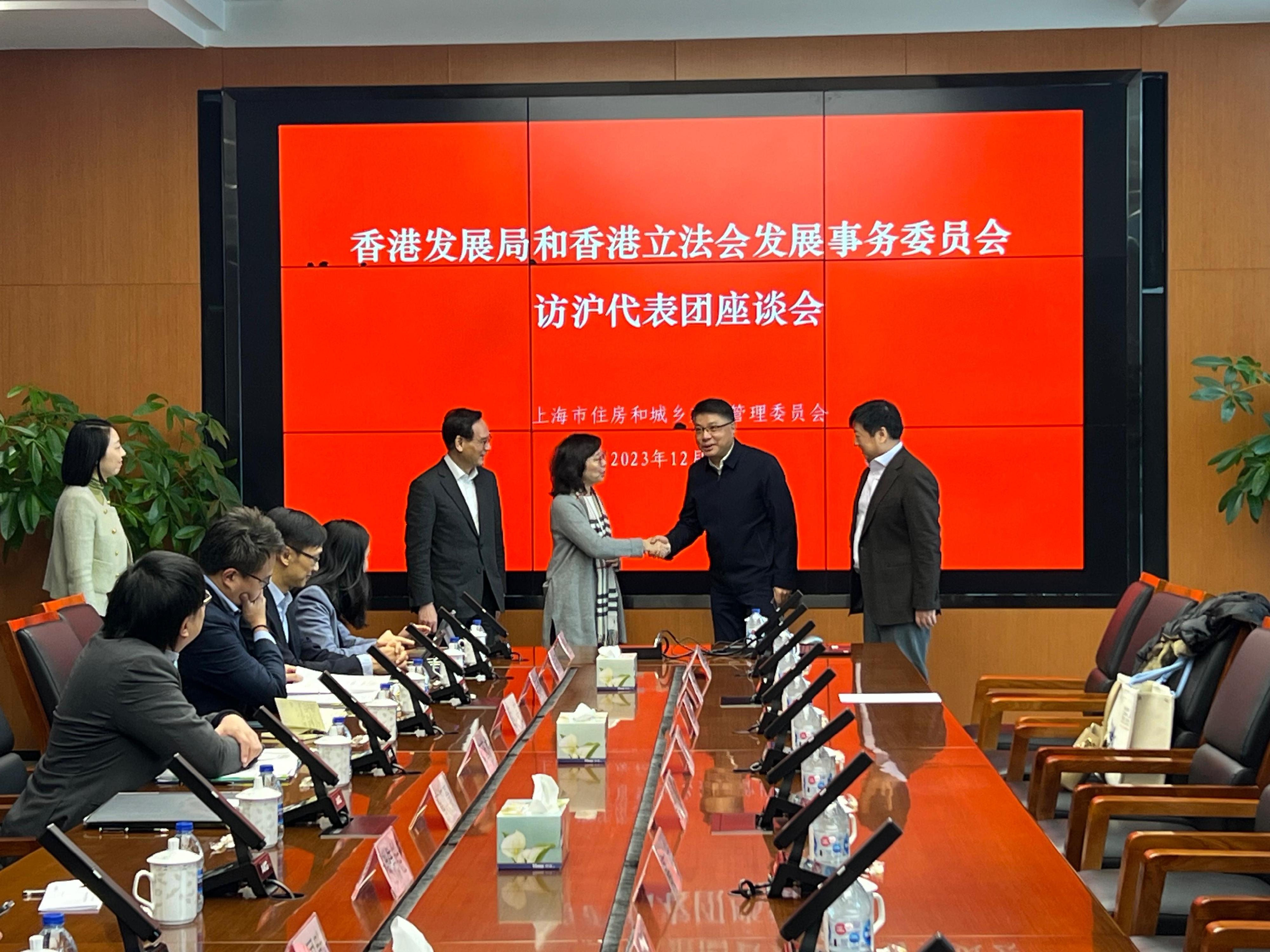 The Secretary for Development, Ms Bernadette Linn, leading a delegation of the Development Bureau, today (December 20) continued her visit to Shanghai, together with a delegation of the Legislative Council Panel on Development. Photos shows Ms Linn (third right) and the delegations visiting the Shanghai Municipal Commission of Housing, Urban-Rural Development and Management (SMCHURDM) meeting with the Director-General of the SMCHURDM, Mr Hu Guangjie (second right), and Deputy Director-General of the SMCHURDM Mr Jin Chen (first right).