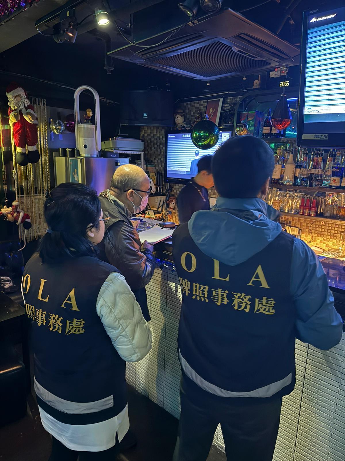 The Office of the Licensing Authority (OLA) of the Home Affairs Department conducted a joint operation with the Fire Services Department codenamed "Solar Flare" against unlicensed hotels/guesthouses and illegal club-house operations for two consecutive days on December 20 and 21 at various spots in areas of Hong Kong Island and Kowloon. Photo shows OLA enforcement officers conducting surprise check at a club-house.
