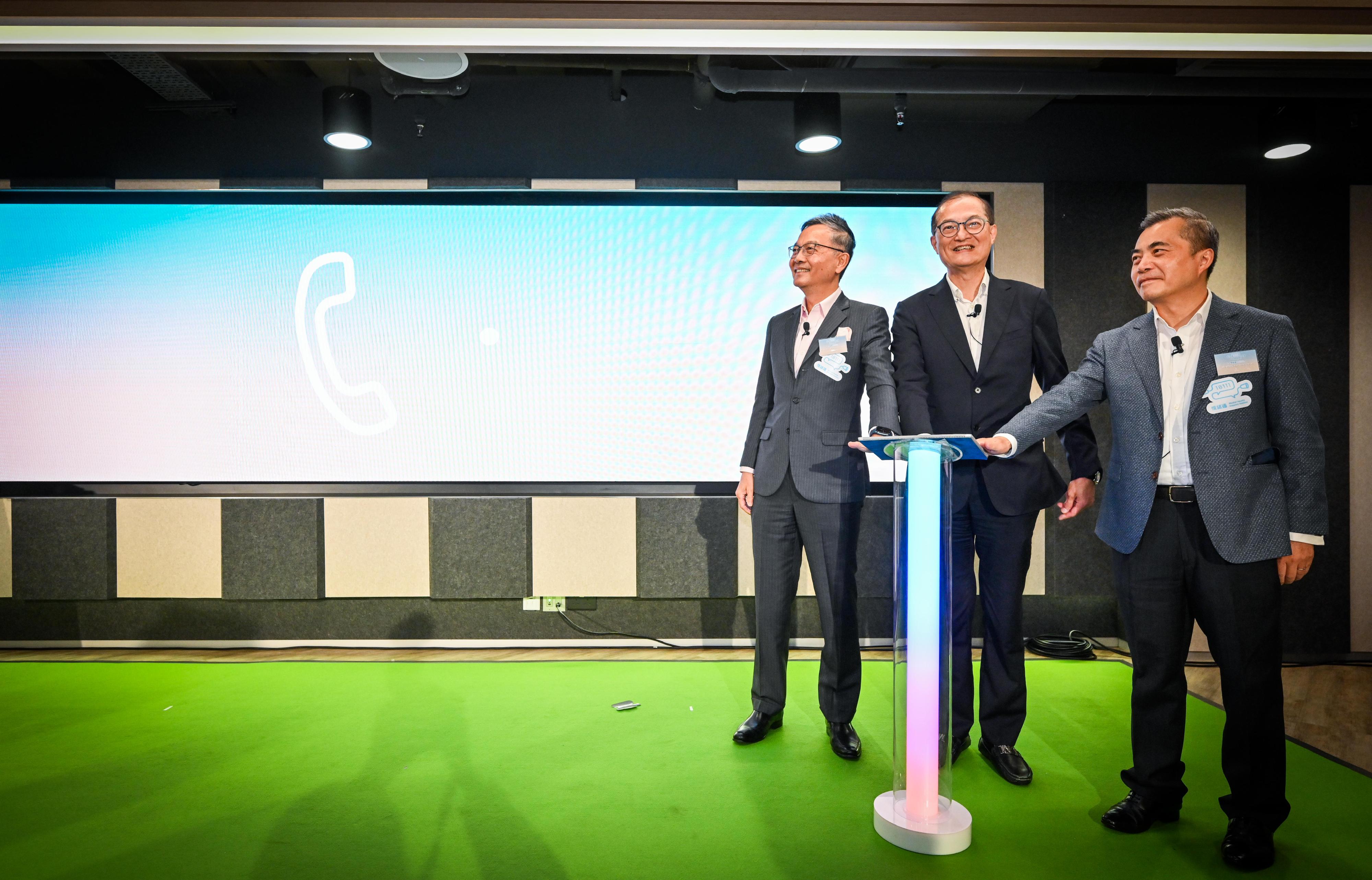 The Secretary for Health, Professor Lo Chung-mau (centre), officiates at the kick-of ceremony of the "18111 - Mental Health Support Hotline" this afternoon (December 27) with the Chairman of the Advisory Committee on Mental Health (ACMH), Dr Lam Ching-choi (left), and former Chairman of the ACMH, Mr Wong Yan-lung, SC (right).