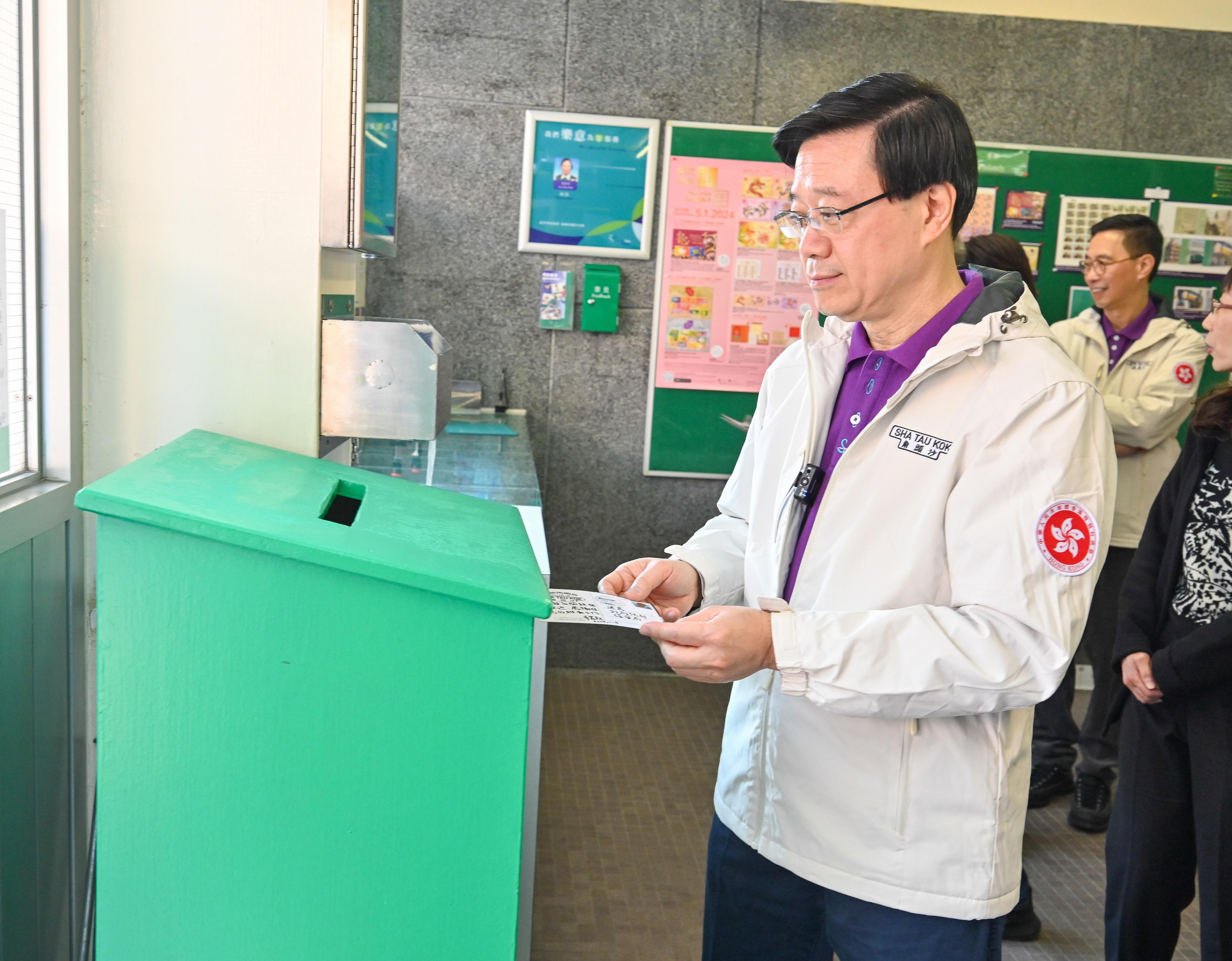 The Chief Executive, Mr John Lee, officiated at the Second Phase Opening-up of Sha Tau Kok Launching Ceremony today (January 6). Photo shows Mr Lee sending a postcard at the Sha Tau Kok Post Office.