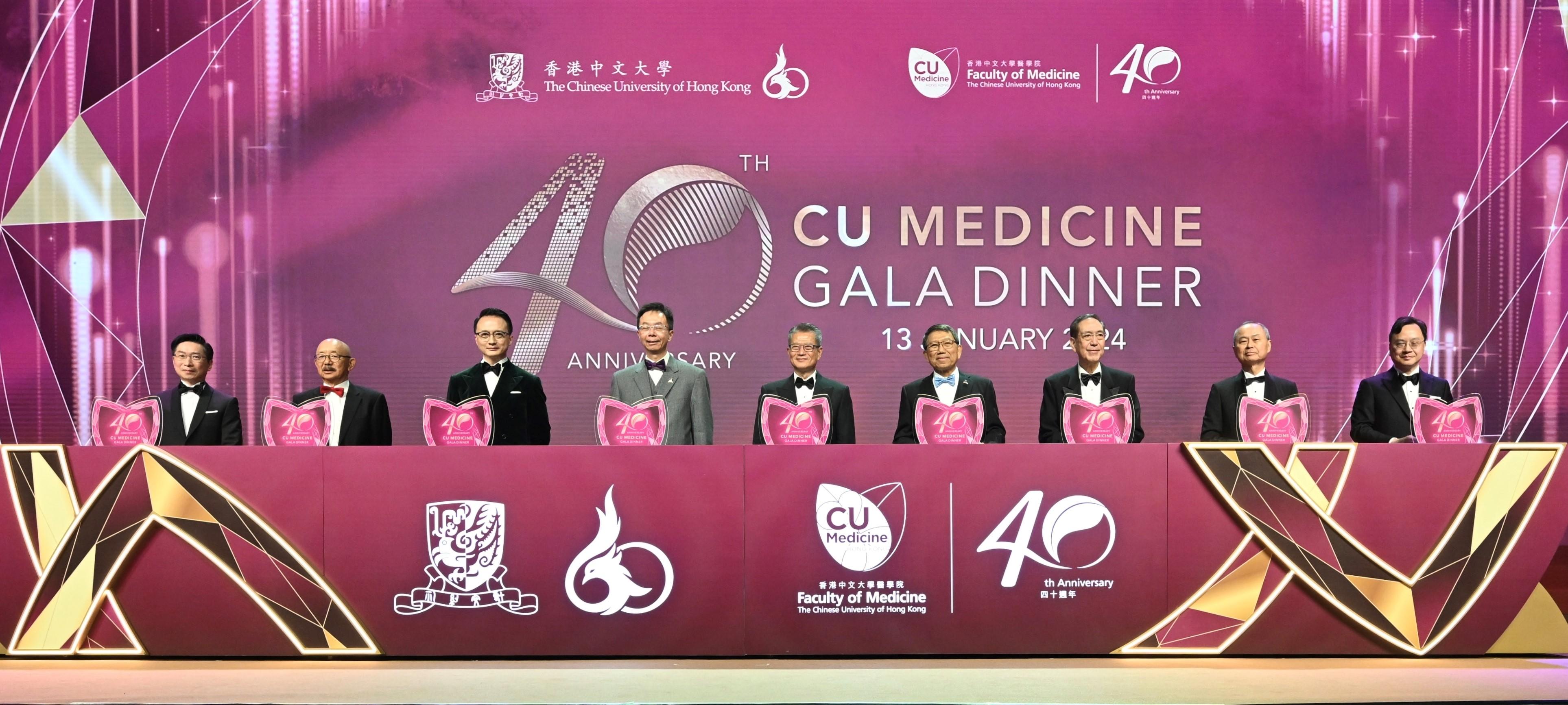 The Financial Secretary, Mr Paul Chan, attended the 40th Anniversary Faculty Gala Dinner hosted by the Faculty of Medicine of the Chinese University of Hong Kong (CUHK) this evening (January 13). Photo shows Mr Paul Chan (centre); the Vice-Chancellor and President of the CUHK, Professor Rocky Tuan (fourth right); the Chairman of the CUHK Council, Professor John Chai (fourth left); the Dean of the Faculty of Medicine of the CUHK, Professor Francis Chan (third left), and other officiating guests at the kick-off ceremony.